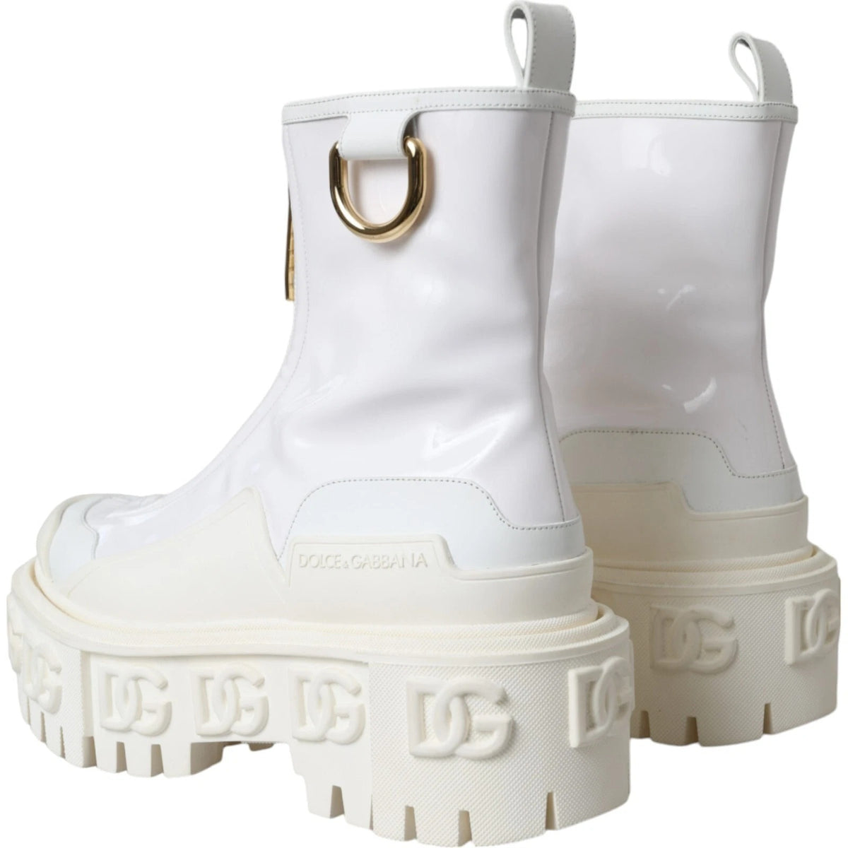 Step into a realm of elegance with Dolce & Gabbana's White Leather Rubber Logo Ankle Boots, where exquisite craftsmanship meets timeless sophistication for the discerning individual.