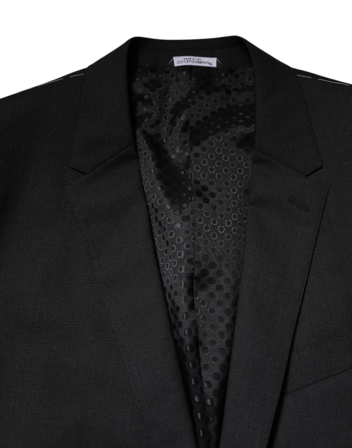 Discover the Dolce & Gabbana Dark Gray MARTINI Single Breasted Jacket, a masterpiece of Italian craftsmanship in luxurious virgin wool, perfect for those who embody elegance and confidence.