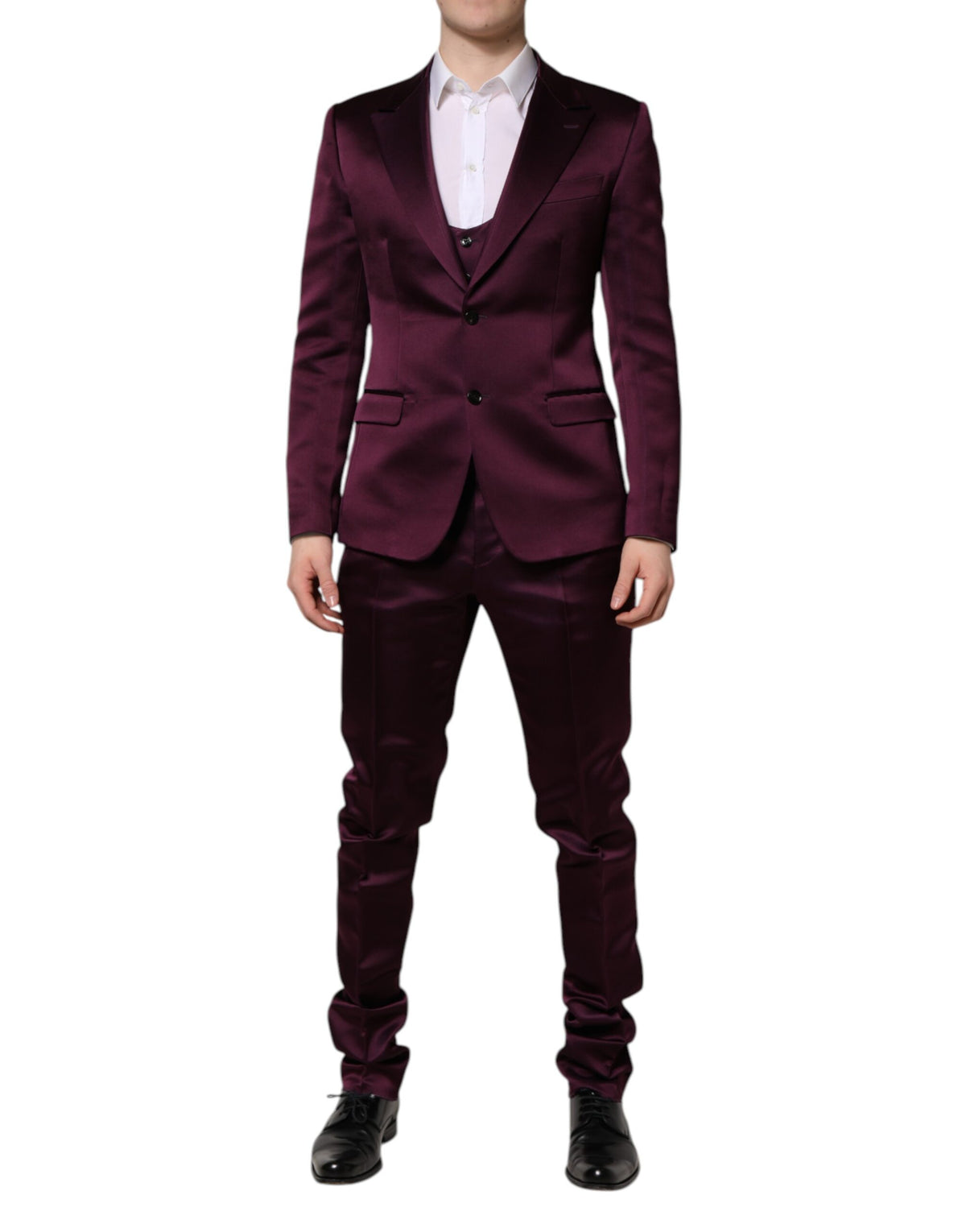 Indulge in the exquisite Dolce & Gabbana Dark Purple Silk 3Piece Suit, a masterpiece of Italian craftsmanship that embodies luxury and sophistication for the discerning individual.