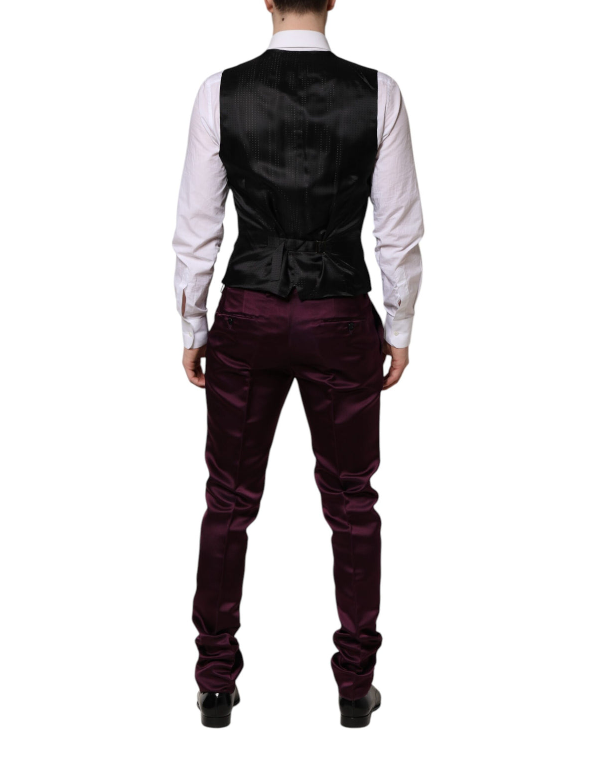 Indulge in the exquisite Dolce & Gabbana Dark Purple Silk 3Piece Suit, a masterpiece of Italian craftsmanship that embodies luxury and sophistication for the discerning individual.