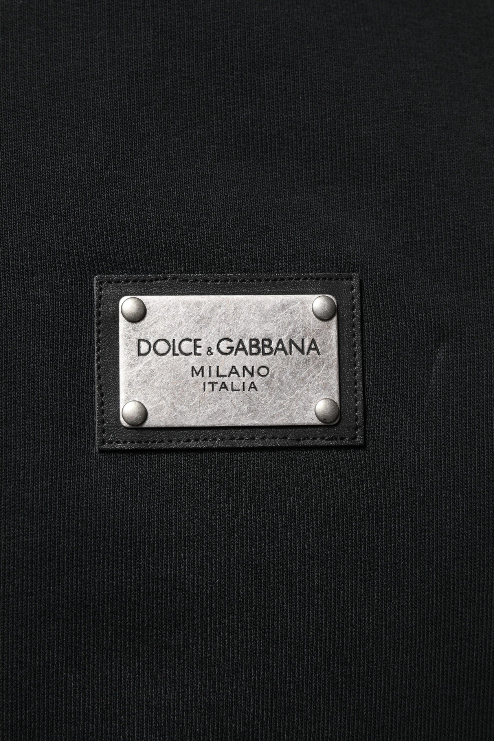 Experience the exquisite Dolce & Gabbana Black Logo Full Zip Hooded Sweatshirt, a luxurious blend of 100% cotton and timeless elegance, perfect for the discerning individual.
