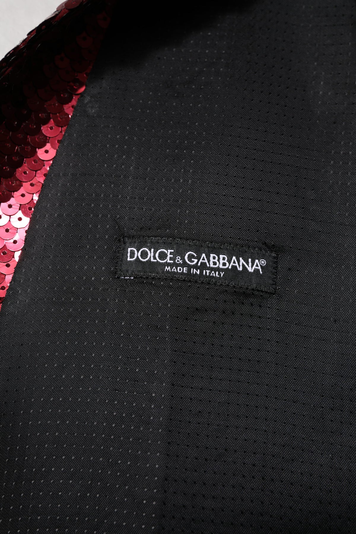 Indulge in the exquisite allure of the Dolce & Gabbana Red Sequined Dress Waistcoat Vest, where luxurious craftsmanship meets captivating design for unforgettable elegance.