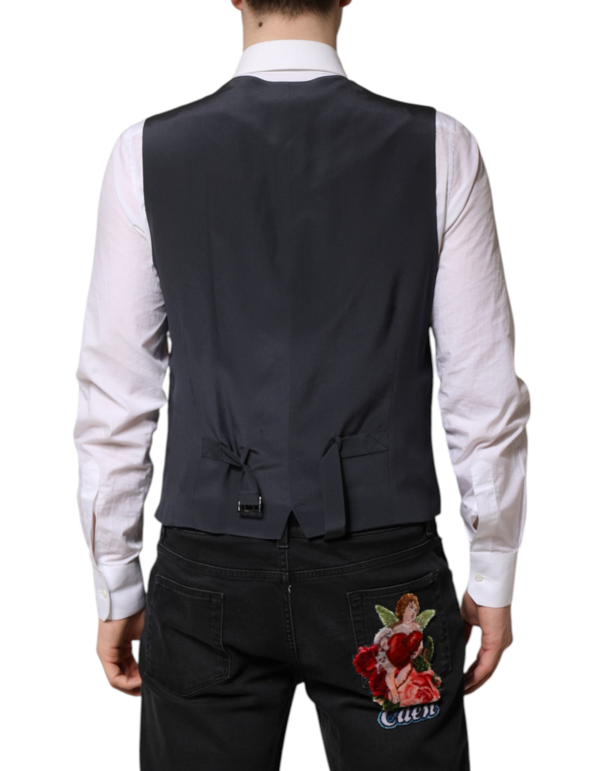 Elevate your elegance with the Dolce & Gabbana Gray Plaid Wool Waistcoat, crafted from 100% virgin wool and silk lining, embodying timeless sophistication for discerning tastes.