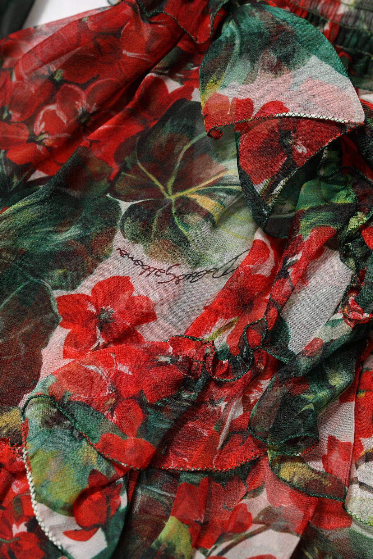 Indulge in the exquisite allure of the Dolce & Gabbana Multicolor Ruffle Floral Long Sleeves Dress, a silk masterpiece that redefines elegance and sophistication.