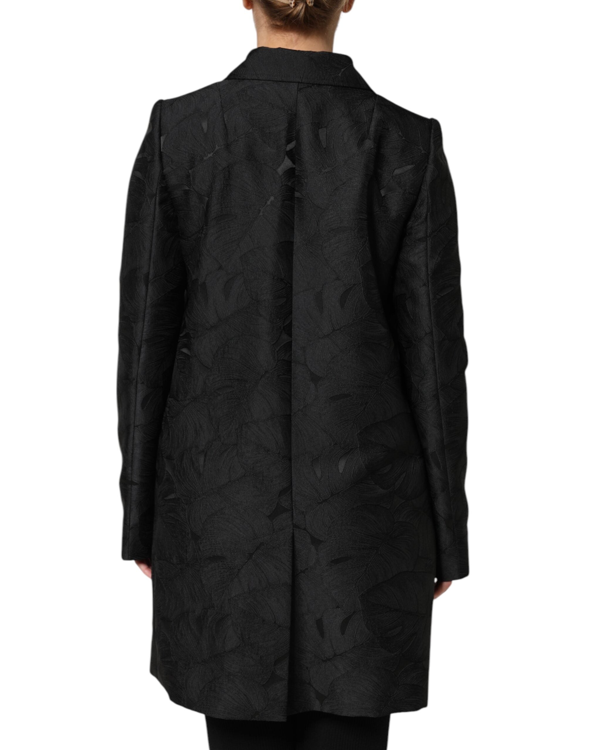 Indulge in the exquisite Dolce & Gabbana Black Single Breasted Trench Coat, crafted in Italy from luxurious materials, embodying timeless elegance and sophisticated allure.