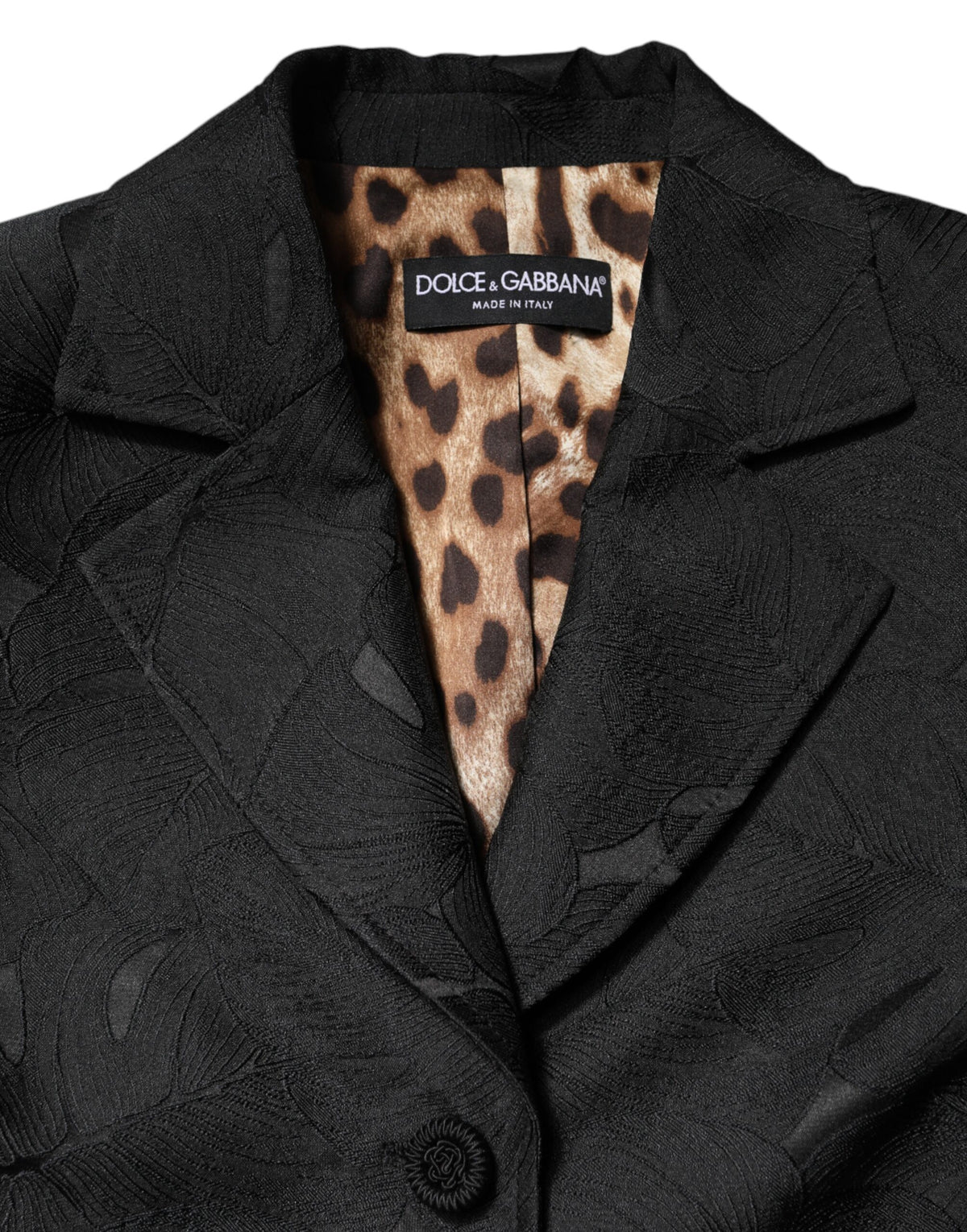 Elevate your wardrobe with the Dolce & Gabbana Black Single Breasted Trench Coat, a masterpiece of Italian craftsmanship, blending luxurious materials for timeless sophistication.