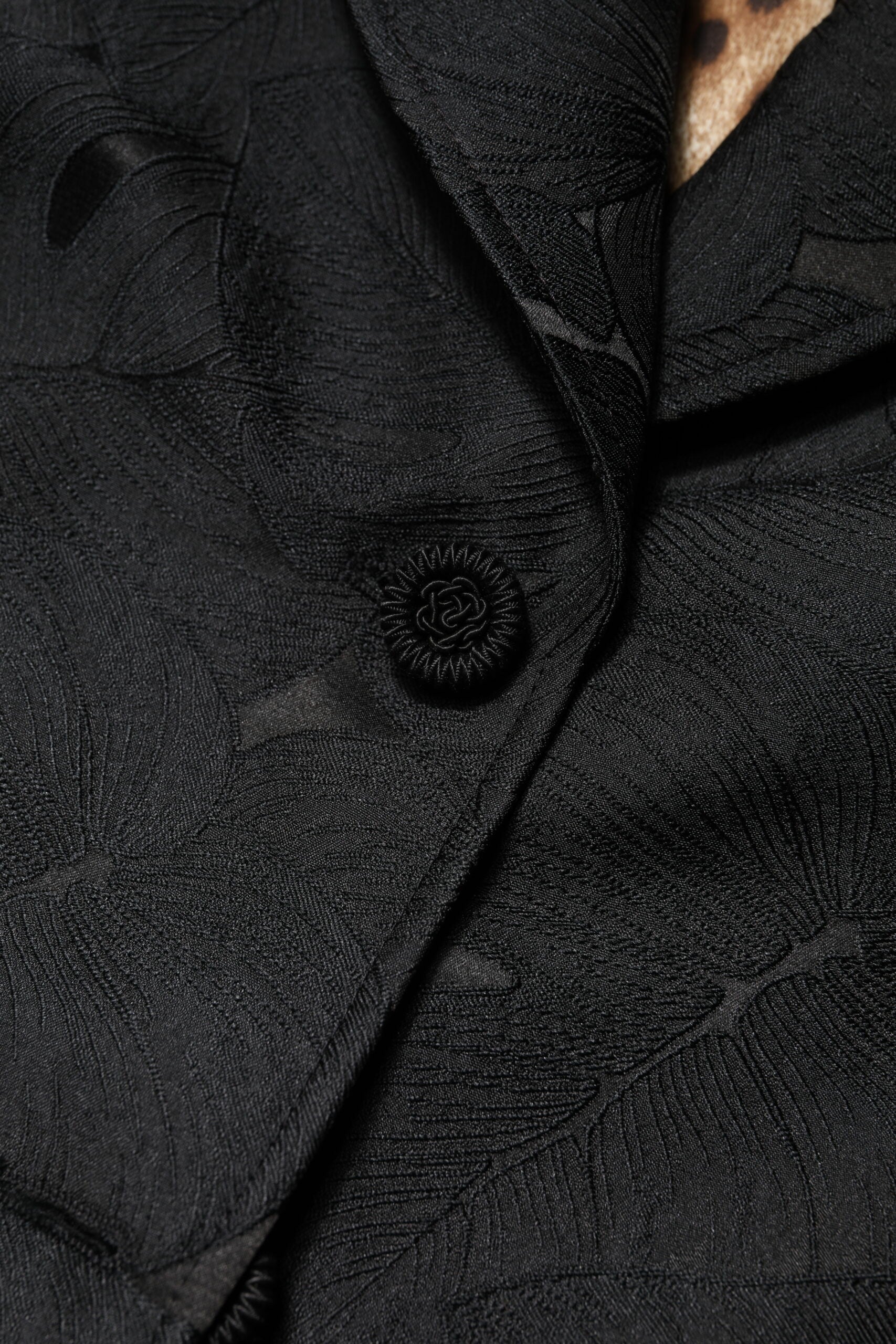 Elevate your wardrobe with the Dolce & Gabbana Black Single Breasted Trench Coat, a masterpiece of Italian craftsmanship in luxurious fabrics that embodies timeless sophistication.
