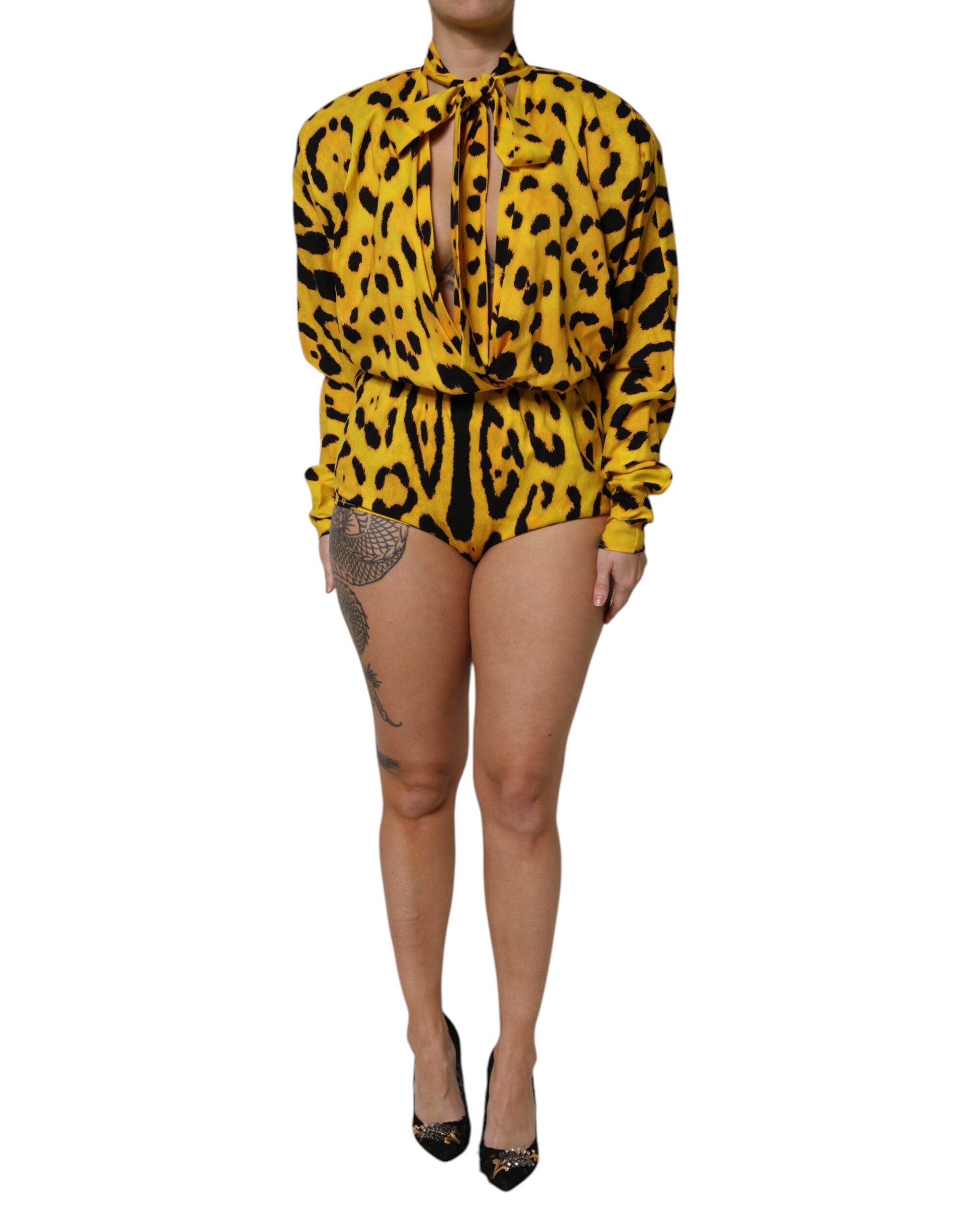 Elevate your style with the Dolce & Gabbana Yellow Leopard Long Sleeves Jumpsuit Dress, a luxurious silk masterpiece that embodies sophistication and allure.