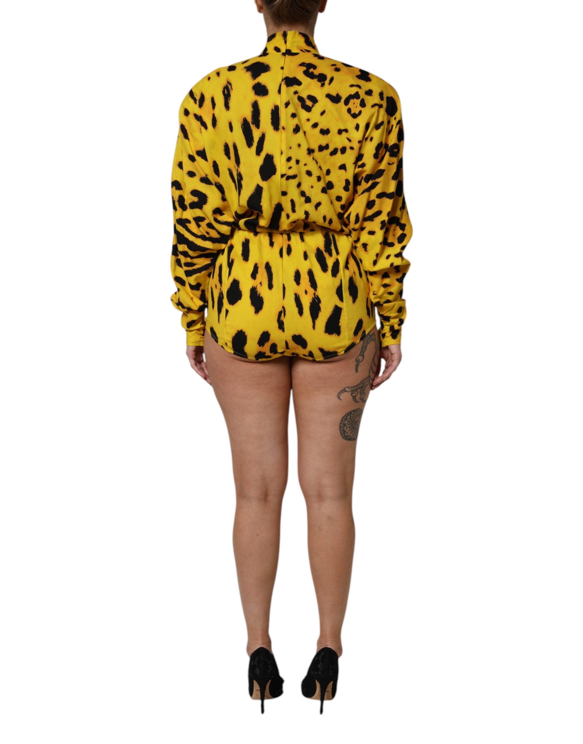 Indulge in the exquisite Dolce & Gabbana Yellow Leopard Long Sleeves Jumpsuit Dress, a luxurious silk masterpiece that embodies elegance and sophistication for every occasion.