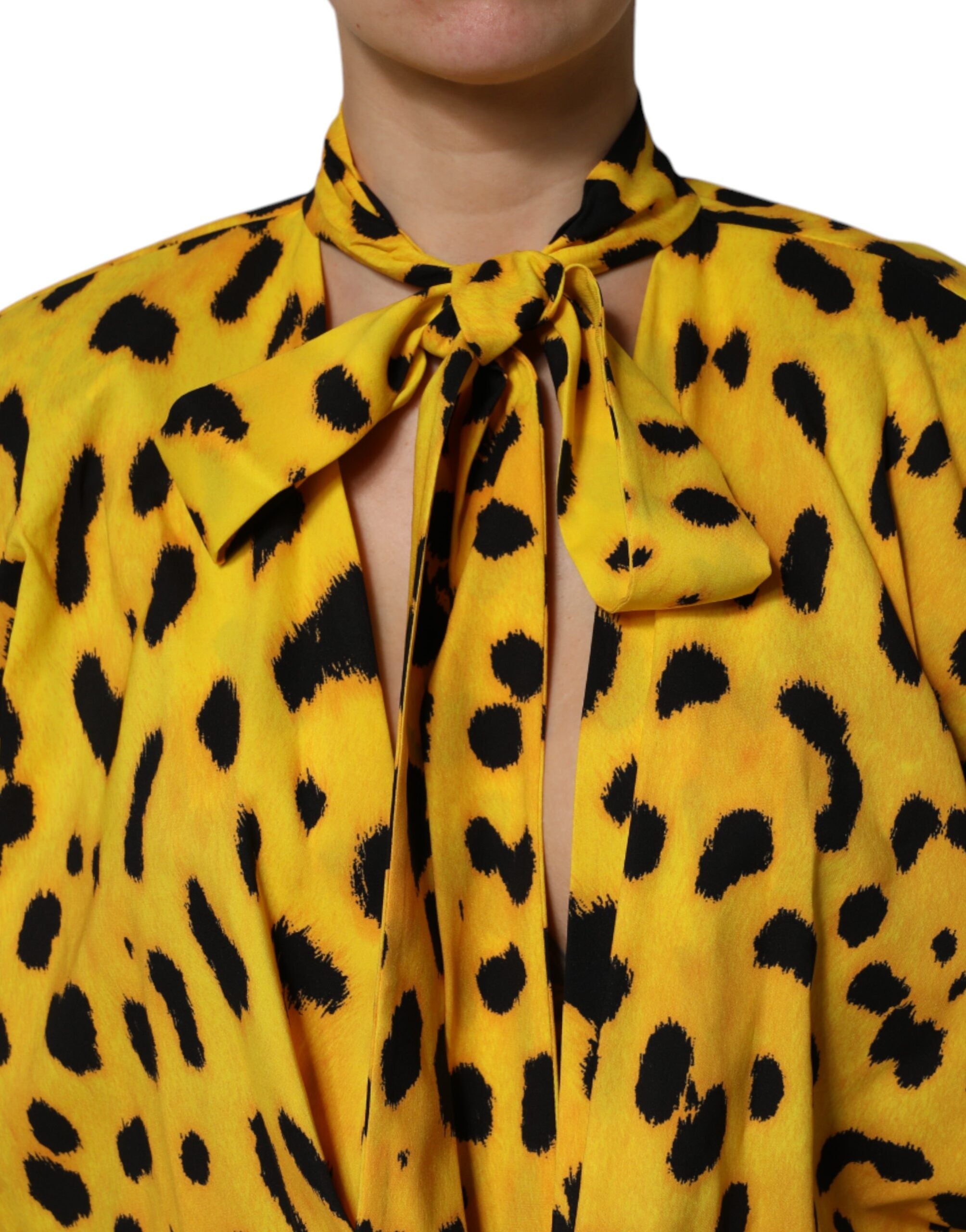 Indulge in the exquisite Dolce & Gabbana Yellow Leopard Long Sleeves Jumpsuit Dress, a luxurious silk creation that embodies sophistication and effortless allure.