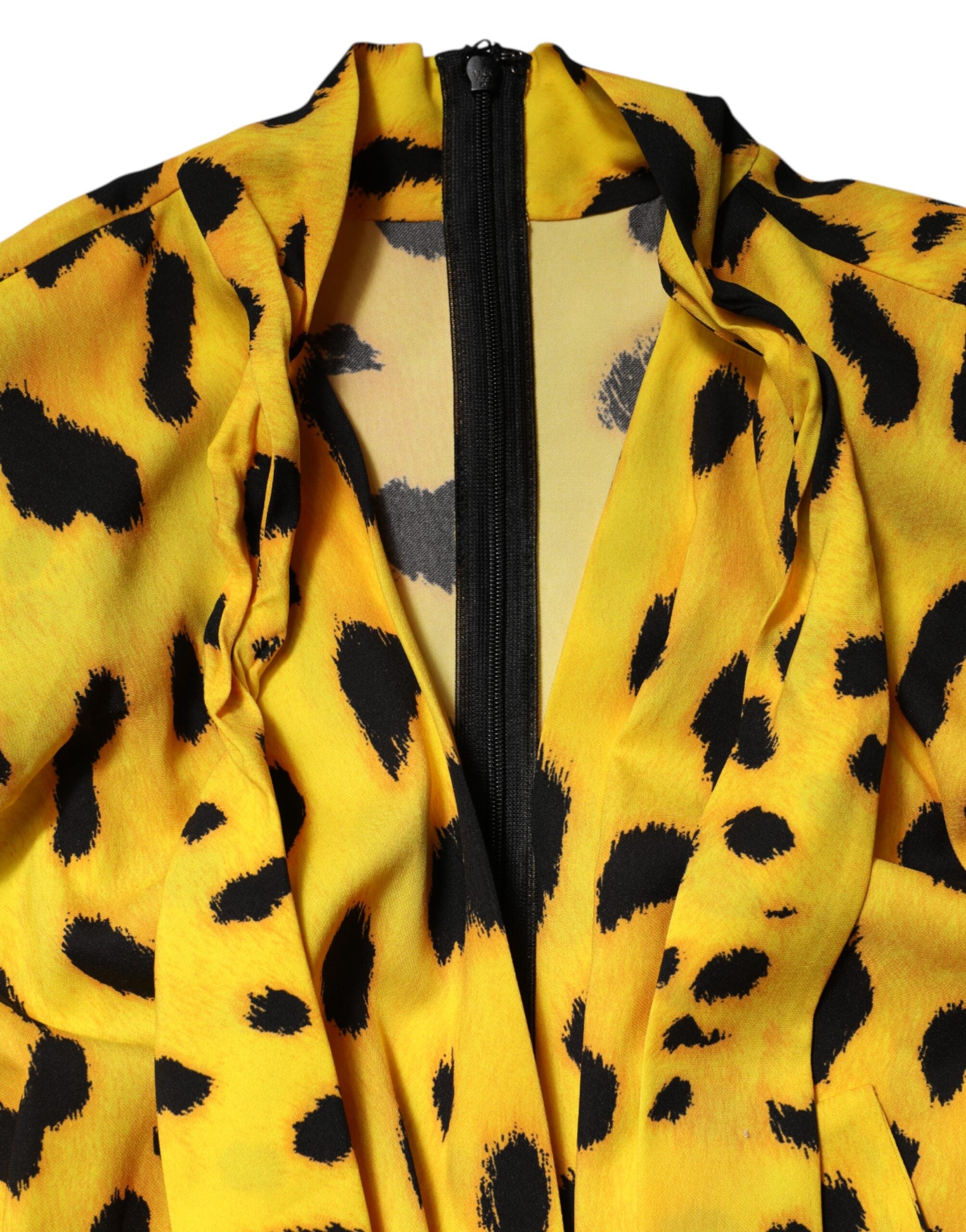 Indulge in the Dolce & Gabbana Yellow Leopard Long Sleeves Jumpsuit Dress, a silk masterpiece that embodies elegance and allure, perfect for the discerning wardrobe.