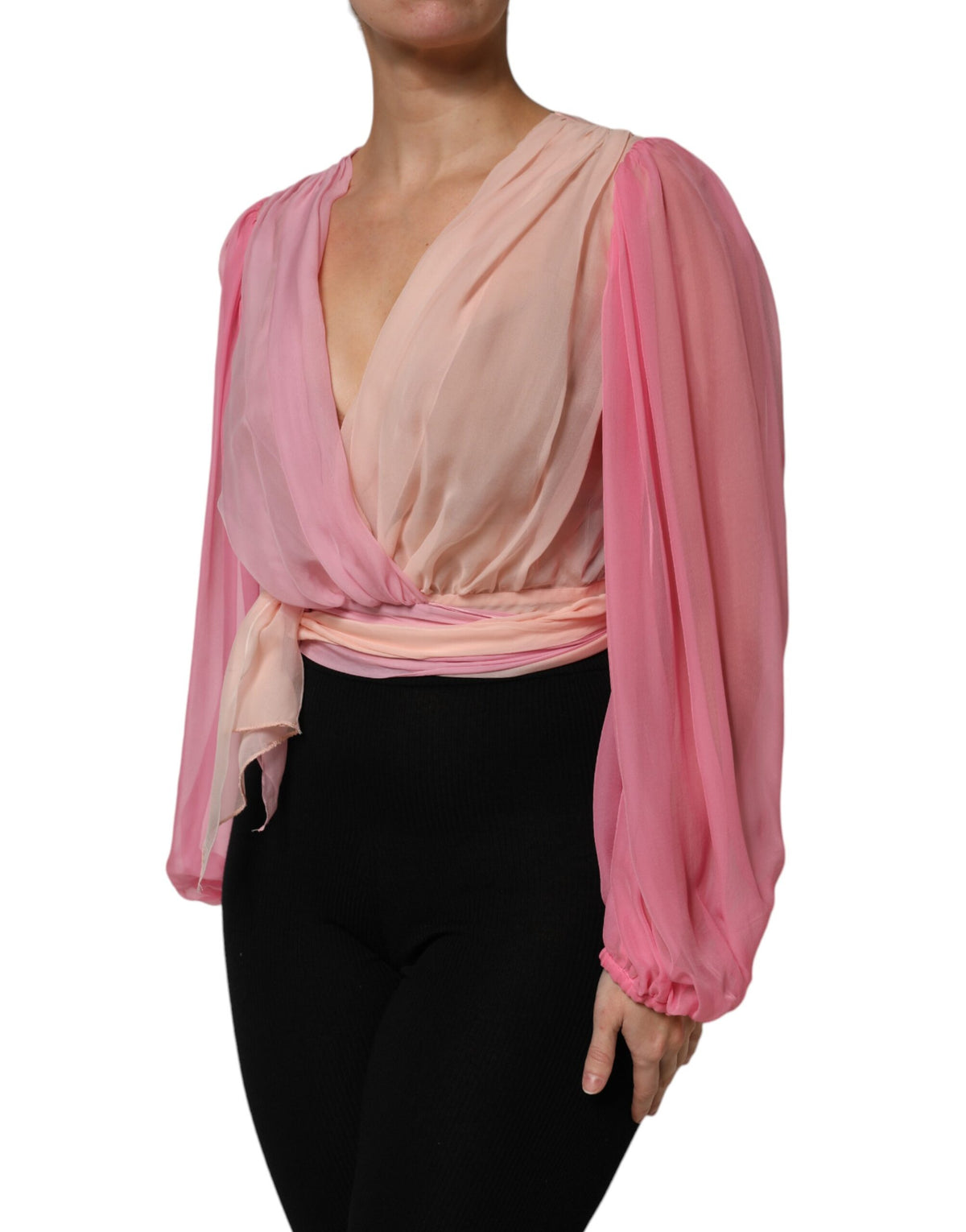 Indulge in the exquisite allure of Dolce & Gabbana's Pink Plunging V-neck Long Sleeves Blouse Top, a silk masterpiece that embodies timeless elegance and Italian craftsmanship.