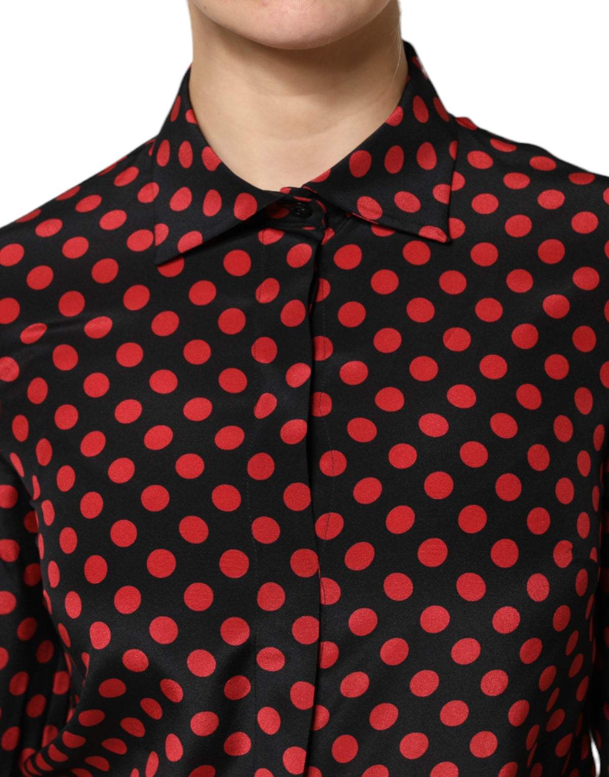 Elevate your wardrobe with the Dolce & Gabbana Black Red Polka Dot Silk Long Sleeves Top, a masterpiece of Italian craftsmanship that exudes timeless elegance and sensual allure.