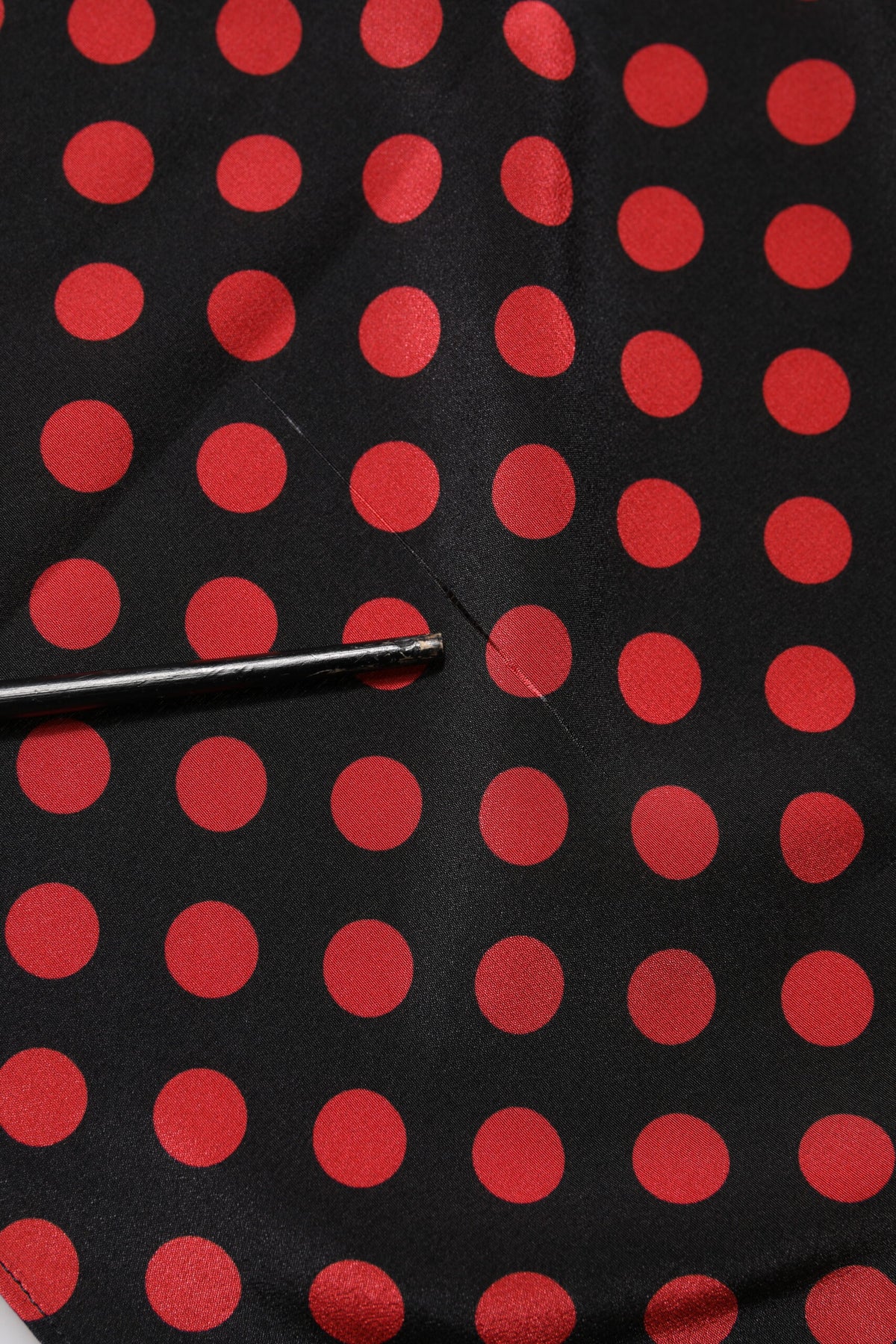 Elevate your wardrobe with the Dolce & Gabbana Black Red Polka Dot Silk Long Sleeves Top, a masterpiece of Italian craftsmanship that embodies timeless elegance and sensual allure.