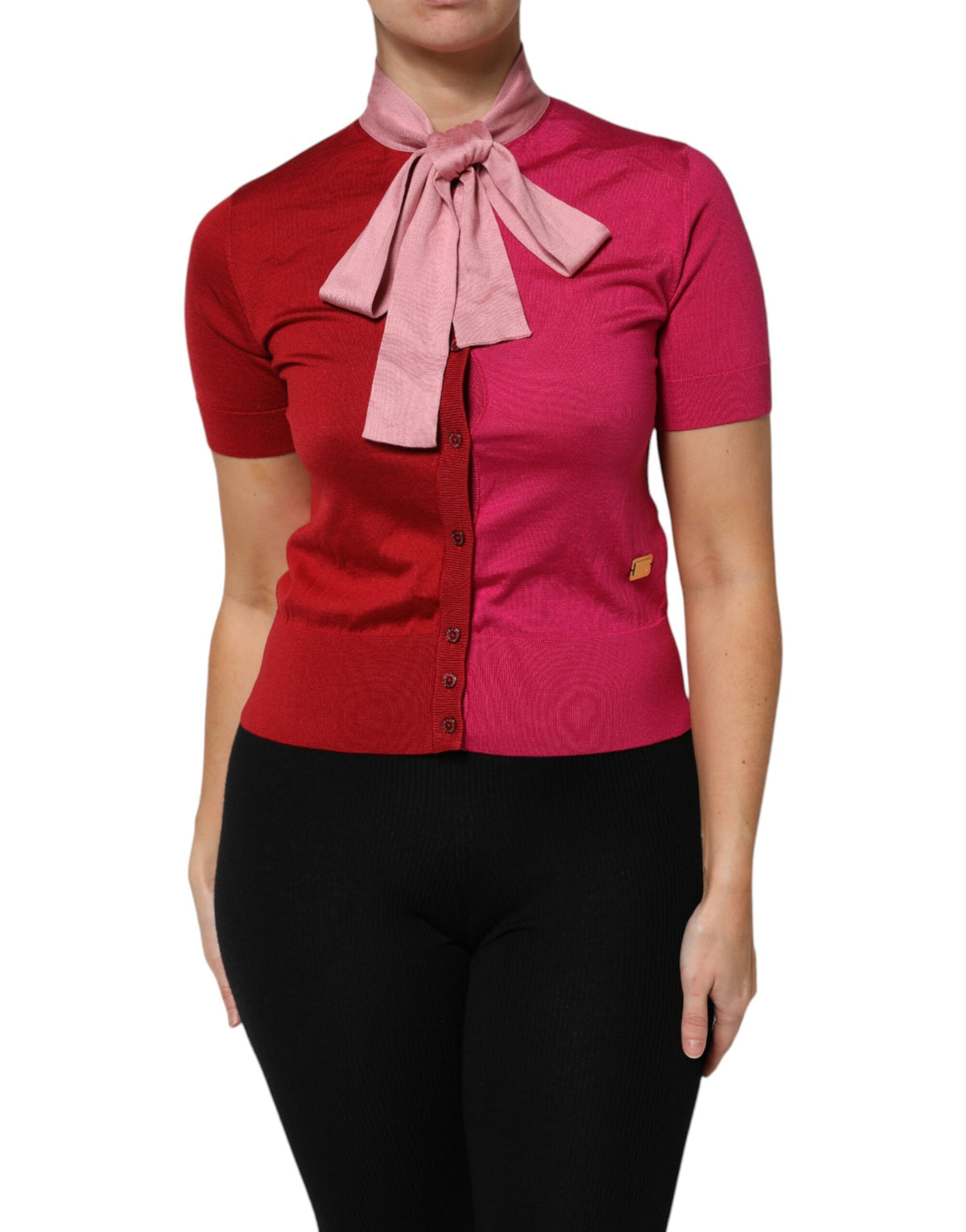 Indulge in the exquisite Dolce & Gabbana Pink Short Sleeves Buttoned Ascot Collar Top, a silk masterpiece that embodies timeless elegance and artisanal craftsmanship for the discerning individual.