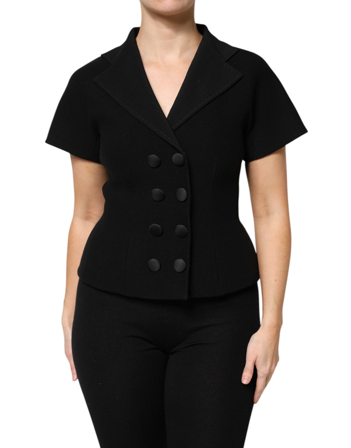 Elevate your wardrobe with the Dolce & Gabbana Black Wool Double Breasted Coat Jacket, a masterpiece of luxurious virgin wool and silk, embodying timeless elegance and refined craftsmanship.
