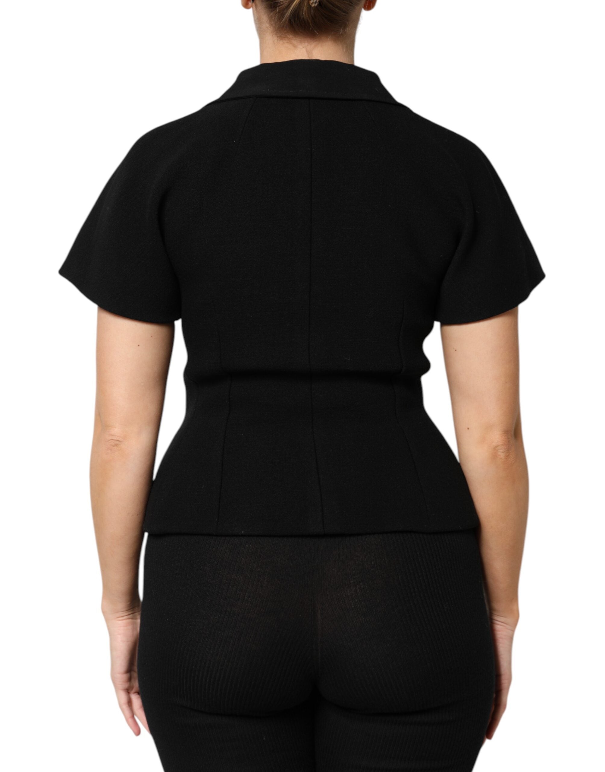 Elevate your wardrobe with the Dolce & Gabbana Black Wool Double Breasted Coat Jacket, a masterpiece of exquisite craftsmanship and luxurious materials, perfect for any occasion.