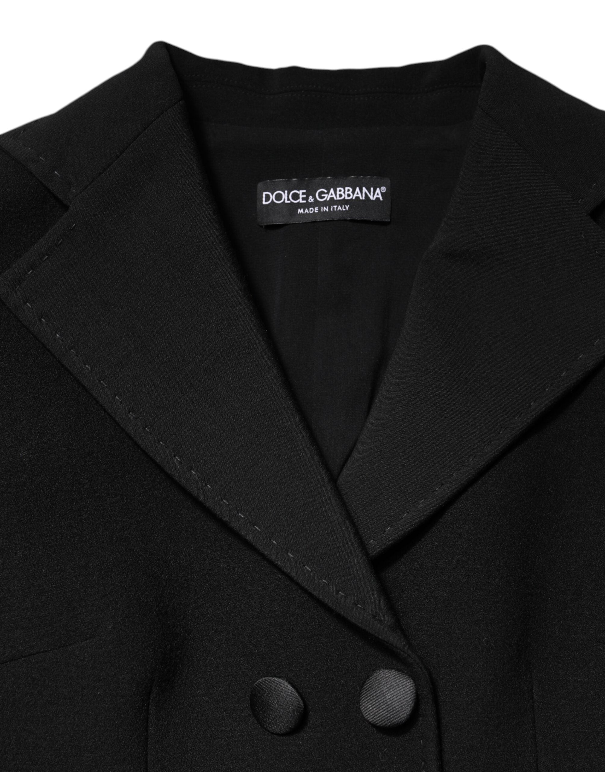 Elevate your style with the Dolce & Gabbana Black Wool Double Breasted Coat Jacket, a masterpiece of Italian craftsmanship blending luxury and timeless elegance.