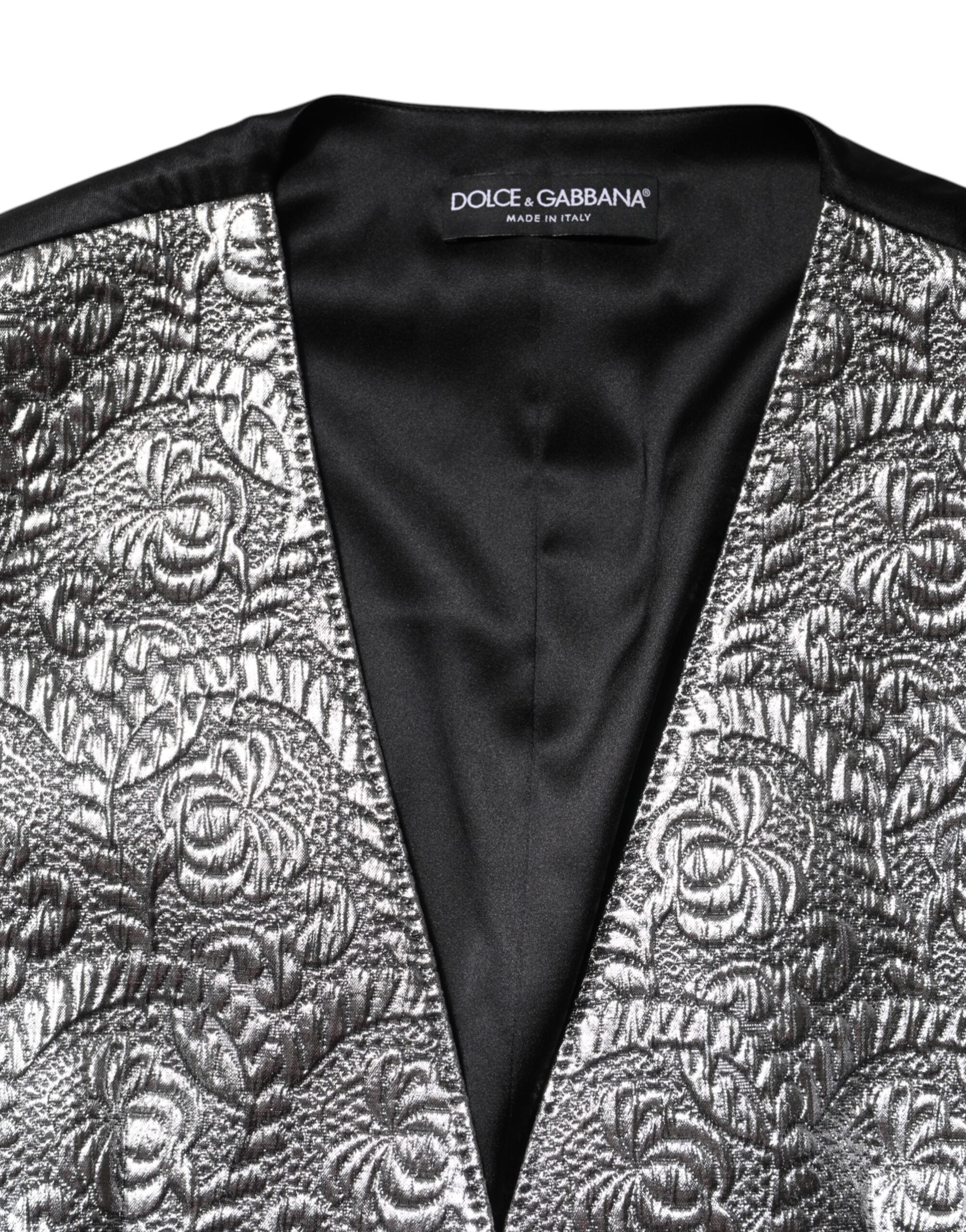 Experience the allure of Dolce & Gabbana's Silver Floral Jacquard Sleeveless Vest Top, a masterpiece of Italian craftsmanship that embodies luxury and timeless elegance.