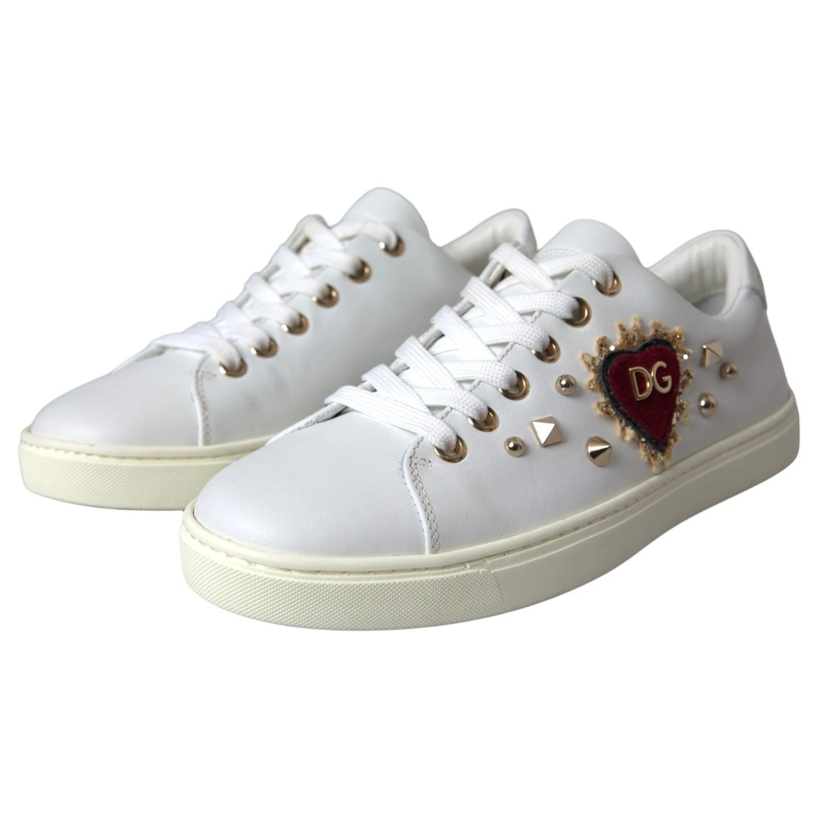 Indulge in the exquisite Dolce & Gabbana Portofino Sneakers, crafted from sumptuous calf leather with striking heart details, embodying luxury and timeless elegance.