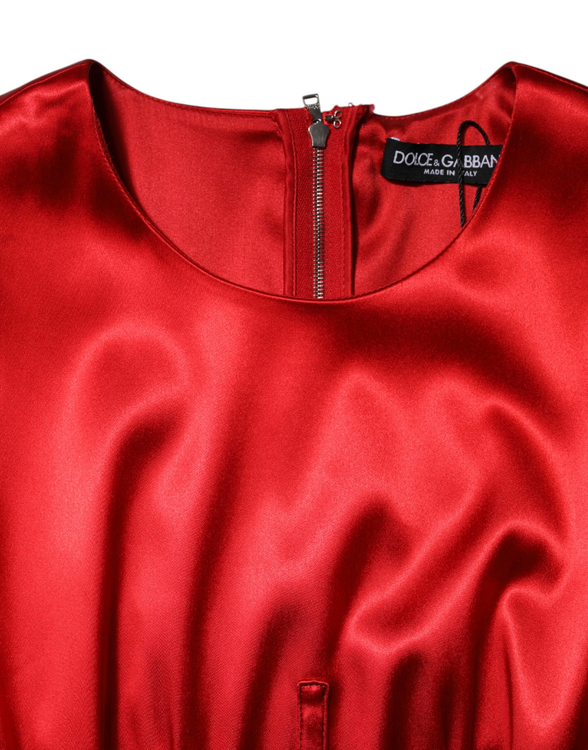 Experience the allure of the Dolce & Gabbana Red Acetate Sleeveless Sheath Midi Dress, a testament to Italian craftsmanship that embodies luxury and sophistication.