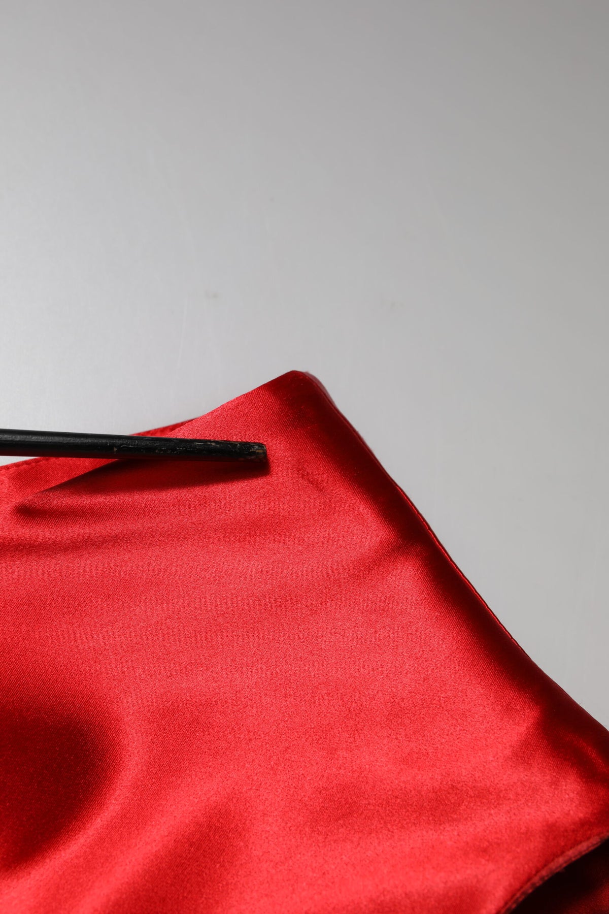 Indulge in the exquisite allure of the Dolce & Gabbana Red Acetate Sleeveless Sheath Midi Dress, where luxurious materials and Italian craftsmanship redefine elegance for the discerning individual.