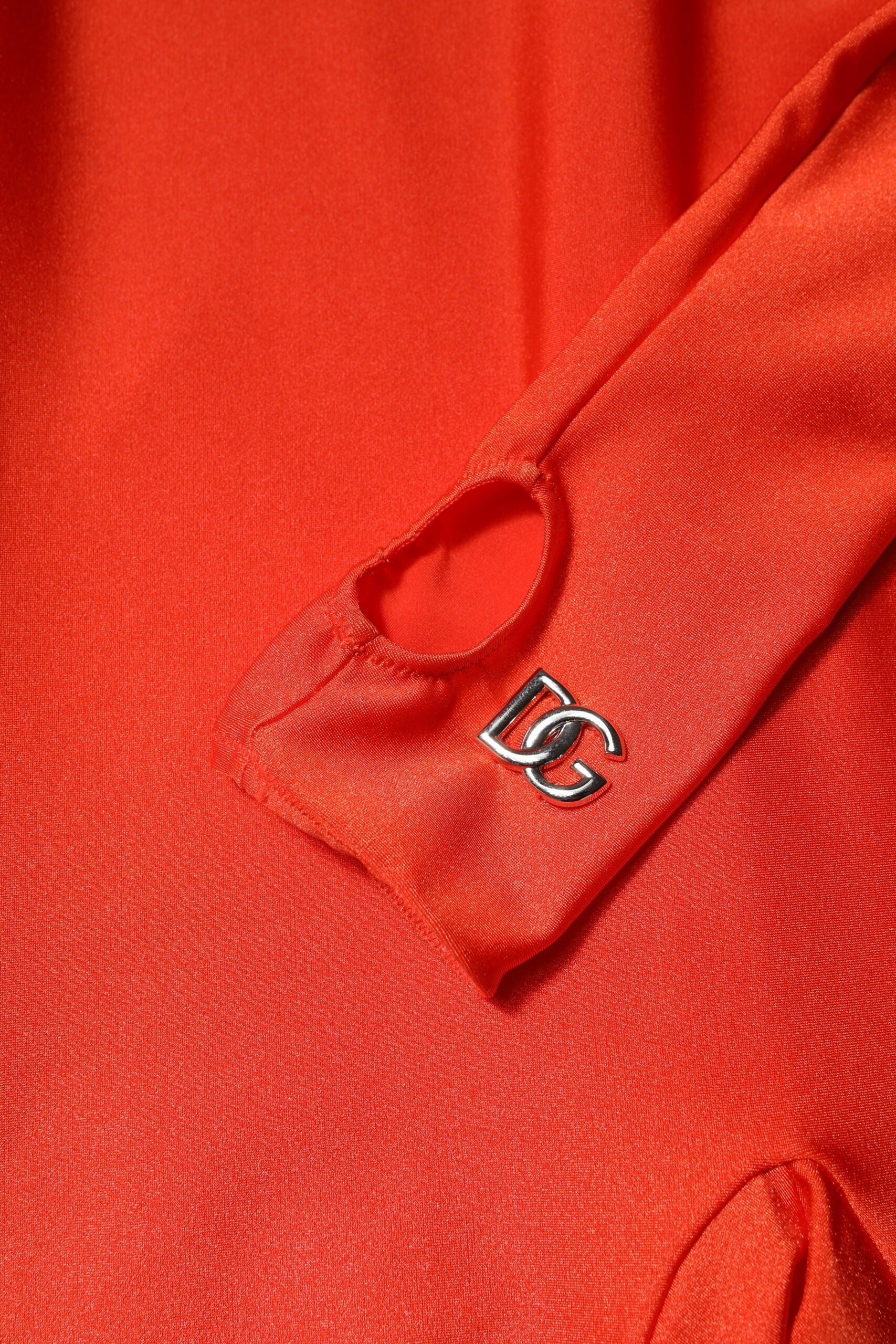 Indulge in the allure of the Dolce & Gabbana Red Nylon Turtleneck Bodycon Jumpsuit Dress, where exquisite Italian craftsmanship meets luxurious comfort for an unforgettable statement.
