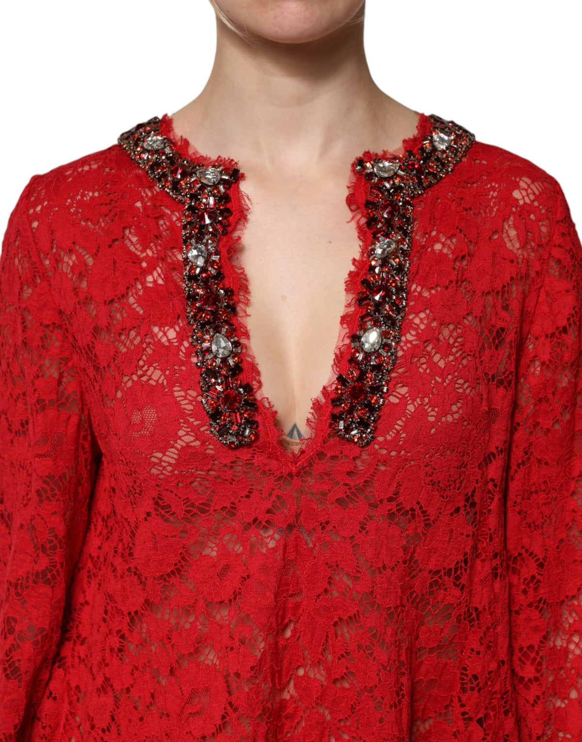 Indulge in the exquisite allure of the Dolce & Gabbana Red Floral Lace Rhinestone Embellished Dress, a masterpiece of Italian craftsmanship that embodies luxury and elegance for the discerning individual.