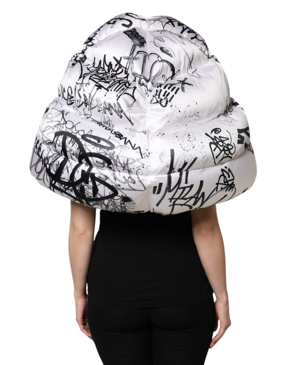 Indulge in the artistry of the Dolce & Gabbana White Polyester Printed Hood Quilted Hat, a timeless accessory that embodies luxury and sophistication for the discerning individual.