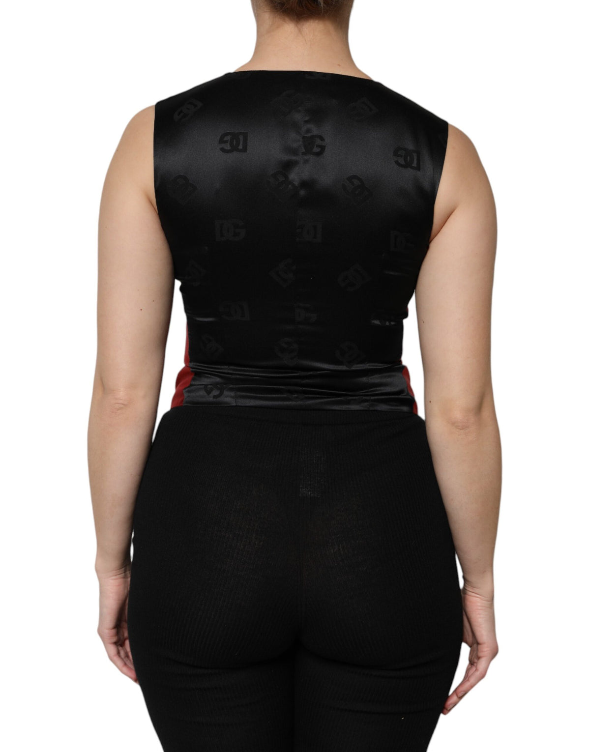 Elevate your wardrobe with the Dolce & Gabbana Red Black Button Down Sleeveless Vest Top, a luxurious silk blend that embodies timeless elegance and exquisite Italian craftsmanship.