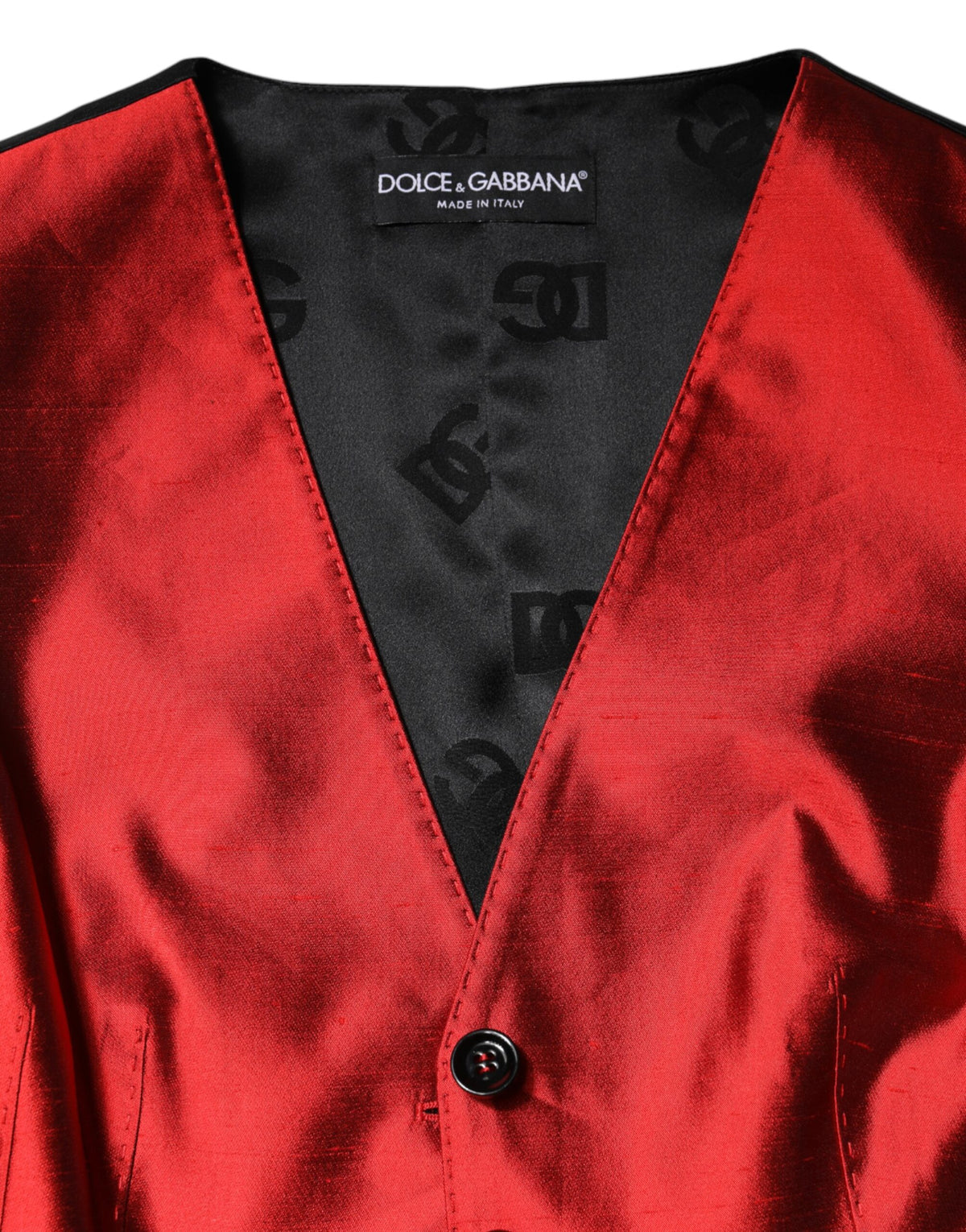 Elevate your wardrobe with the Dolce & Gabbana Red Black Button Down Sleeveless Vest Top, a luxurious silk blend that embodies exquisite Italian craftsmanship and timeless elegance.