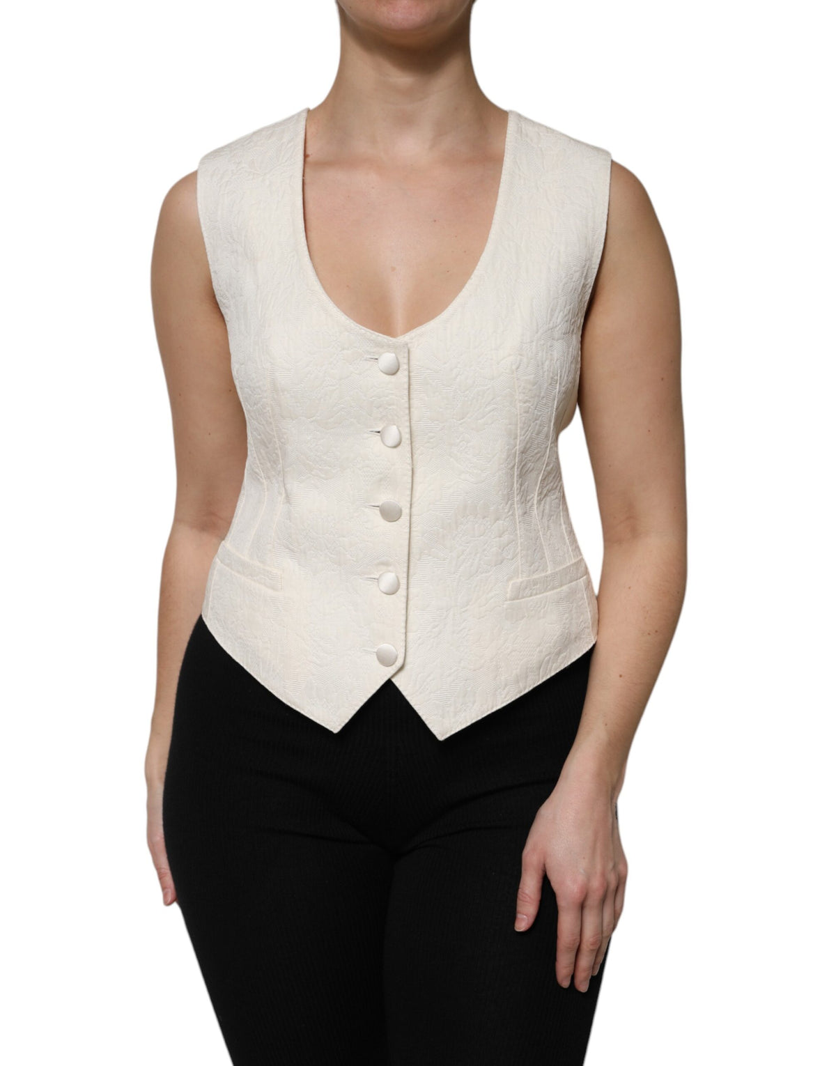 Elevate your wardrobe with the Dolce & Gabbana Ivory Cotton Button Down Sleeveless Vest Top, a masterpiece of Italian craftsmanship blending luxurious cotton and silk for timeless elegance.