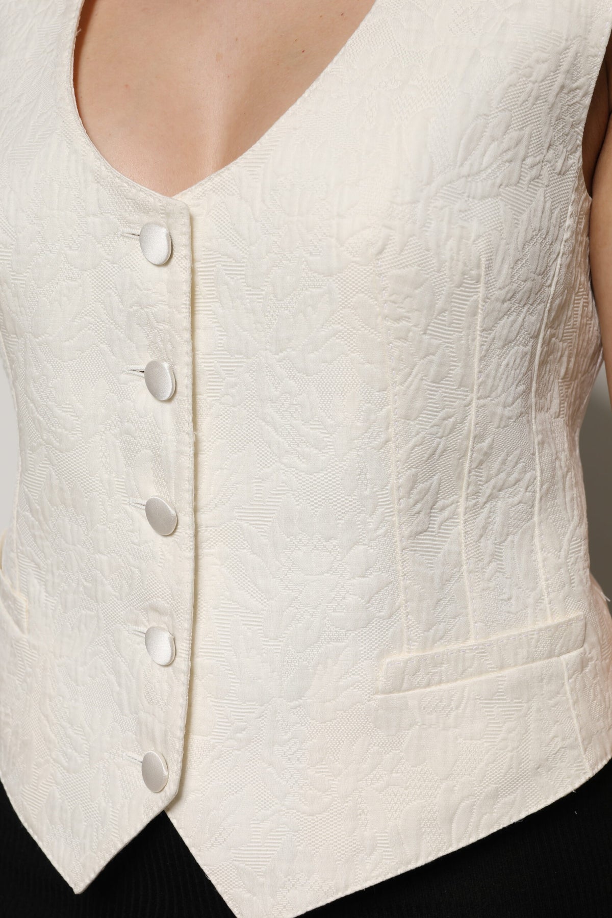 Elevate your wardrobe with the Dolce & Gabbana Ivory Cotton Button Down Sleeveless Vest Top, a masterpiece of Italian craftsmanship blending luxury cotton and silk for timeless elegance.