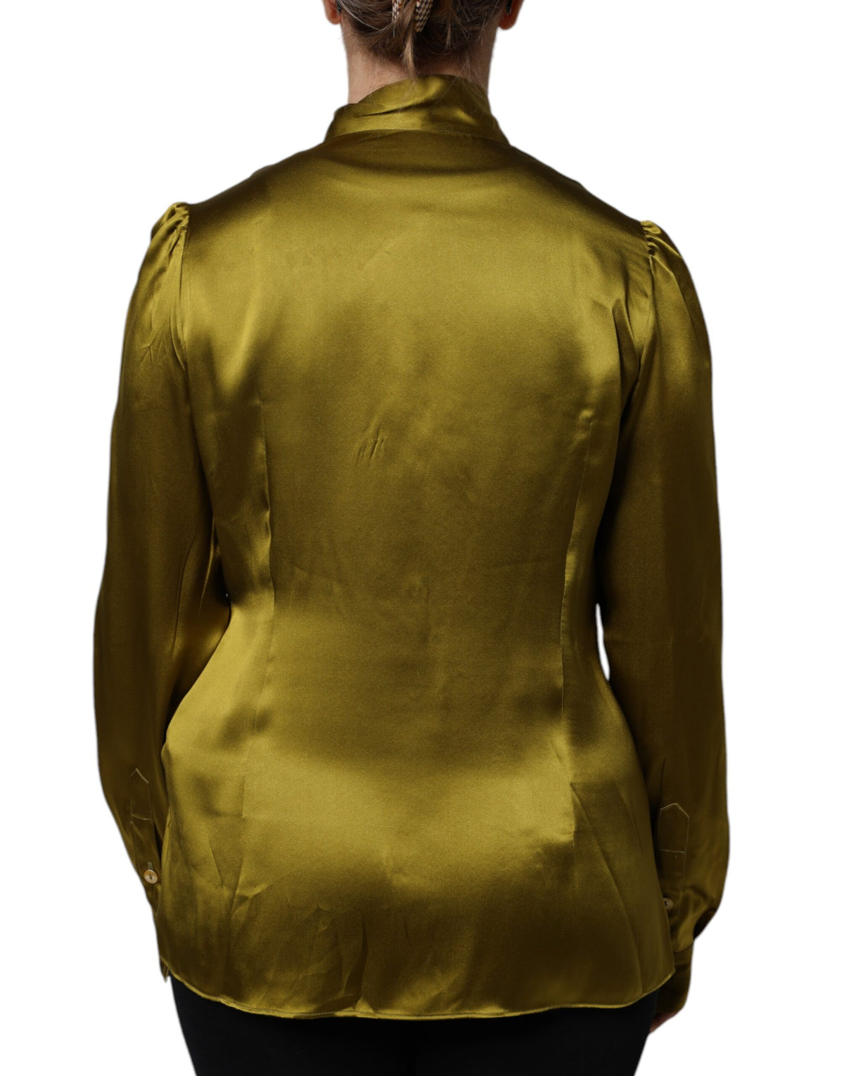 Indulge in the allure of the Dolce & Gabbana Green Ascot Collar Blouse, crafted from luxurious silk, epitomizing timeless elegance and sophisticated craftsmanship for the discerning wardrobe.