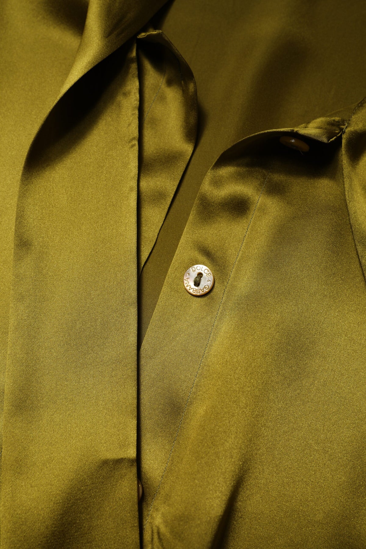 Indulge in the allure of Dolce & Gabbana's Green Ascot Collar Blouse, crafted from luxurious silk, embodying timeless elegance and exquisite Italian craftsmanship.