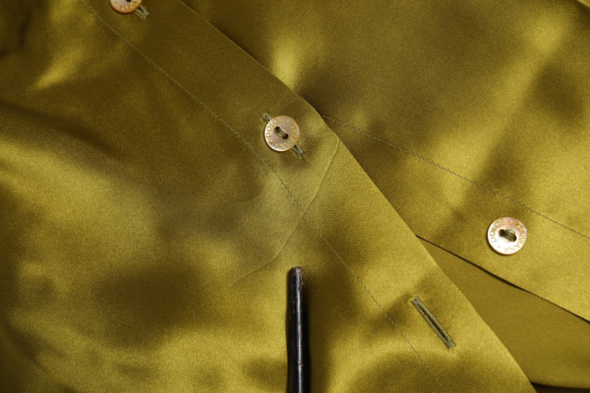 Elevate your wardrobe with the Dolce & Gabbana Green Ascot Collar Long Sleeves Blouse, a luxurious silk masterpiece that embodies timeless Italian sophistication and allure.