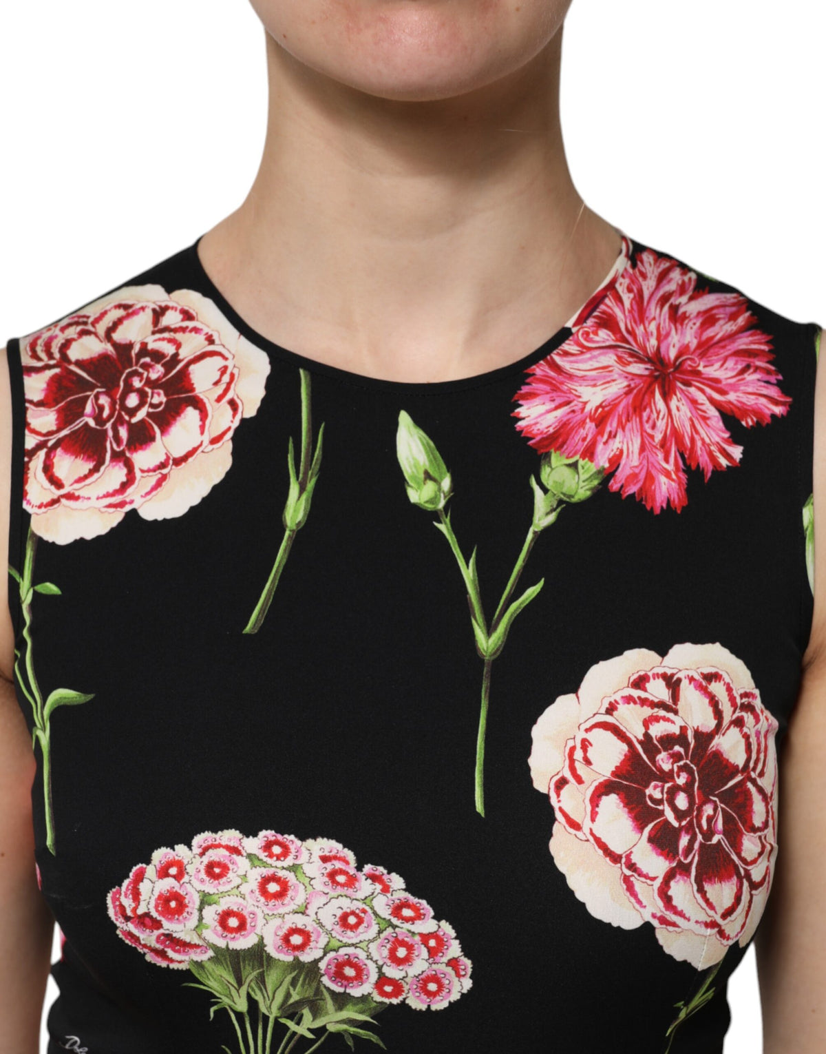 Indulge in the exquisite allure of the Dolce & Gabbana Black Floral Print Sleeveless Tank Blouse, crafted from luxurious silk and elastane, embodying timeless elegance and Italian craftsmanship for the discerning individual.