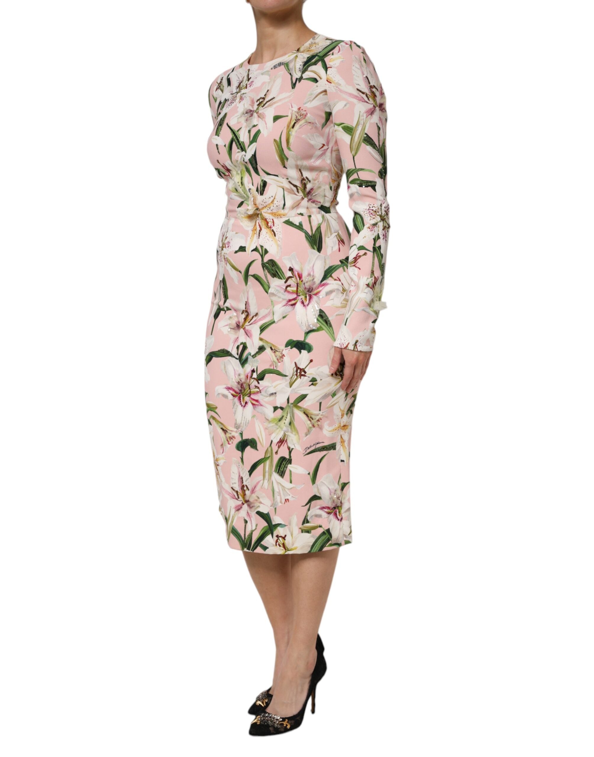 Indulge in the exquisite allure of the Dolce & Gabbana Pink Lily Viscose Sheath Midi Dress, crafted in Italy from luxurious materials, embodying elegance and sophistication for every occasion.