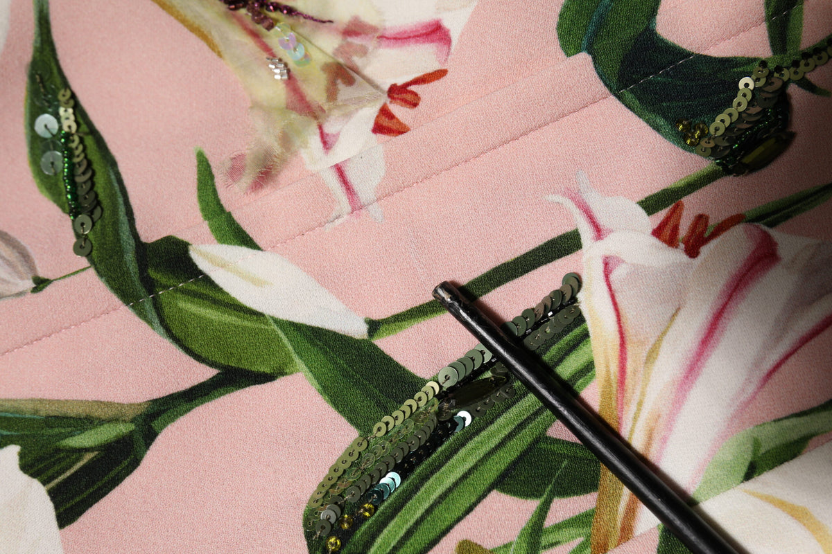 Indulge in the exquisite allure of the Dolce & Gabbana Pink Lily Viscose Sheath Midi Dress, where luxurious materials and Italian craftsmanship redefine elegance for every occasion.