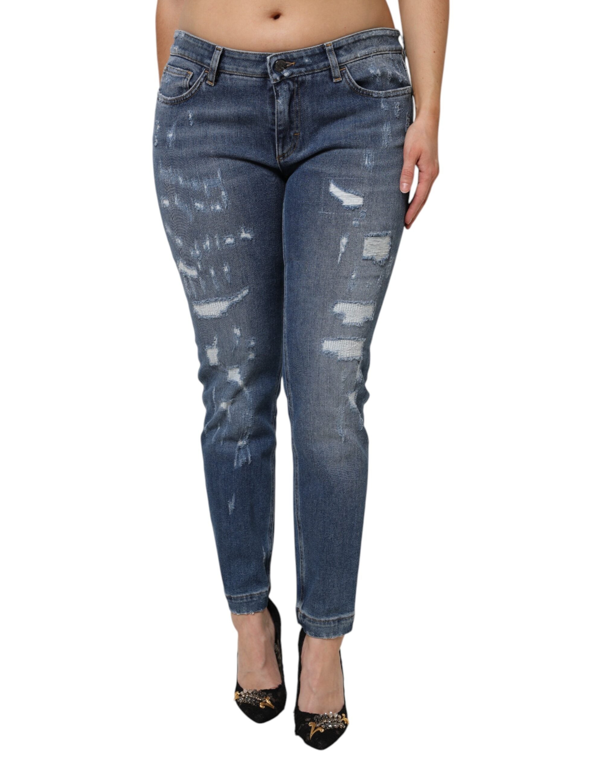 Indulge in the exquisite Dolce & Gabbana Blue Tattered Cotton Low Waist Denim Jeans, where Italian craftsmanship meets a sophisticated silhouette for the discerning fashionista.