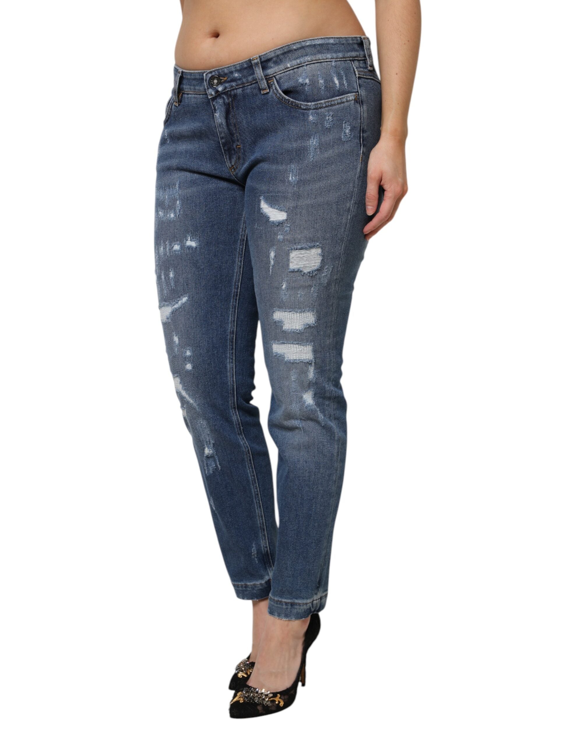 Indulge in the exquisite Dolce & Gabbana Blue Tattered Cotton Low Waist Denim Jeans, where Italian craftsmanship meets modern elegance for the discerning fashionista.