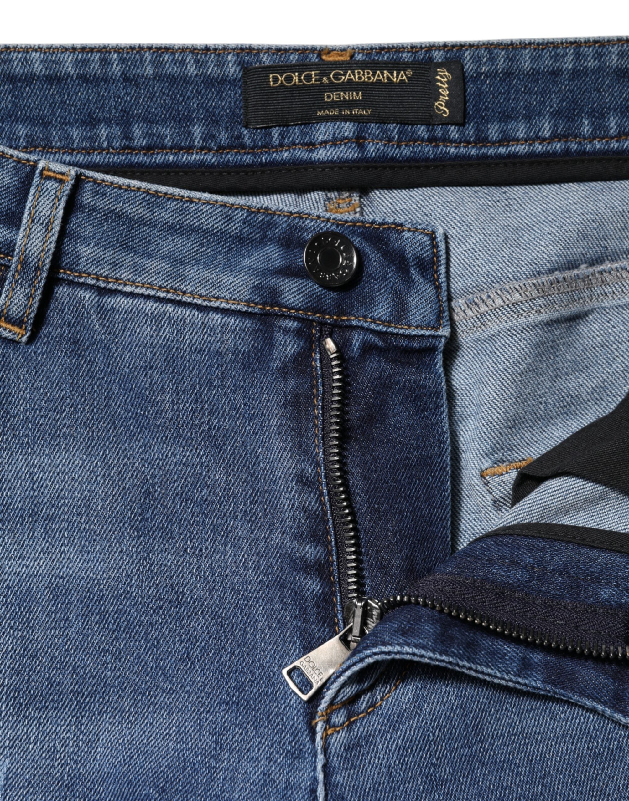 Indulge in the exquisite craftsmanship of Dolce & Gabbana's Blue Tattered Cotton Low Waist Denim Jeans, where timeless Italian elegance meets modern sophistication.