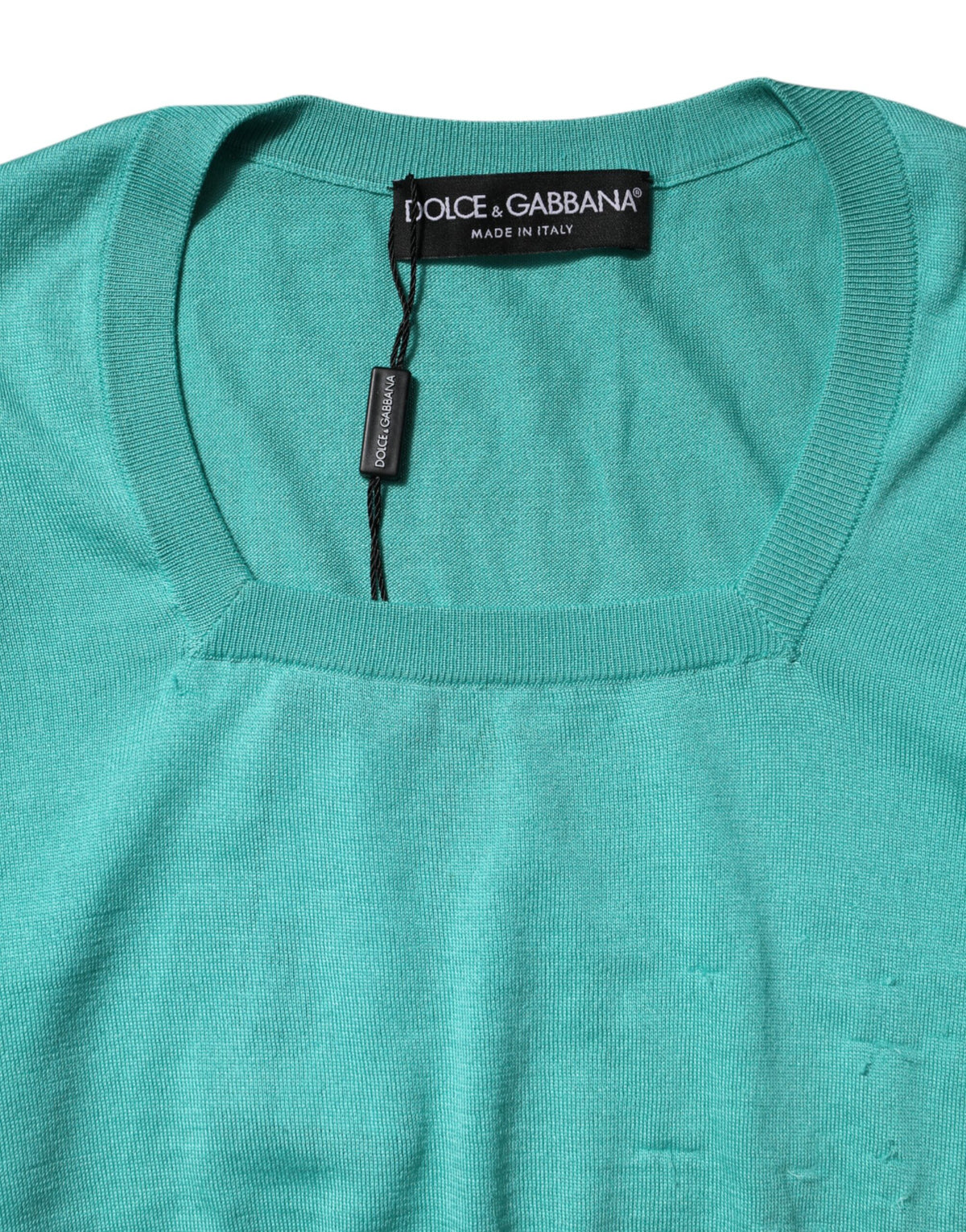 Discover the allure of Dolce & Gabbana's Aqua Blue Silk Short Sleeves Square Neck Top, a testament to Italian craftsmanship that embodies luxury and individuality.