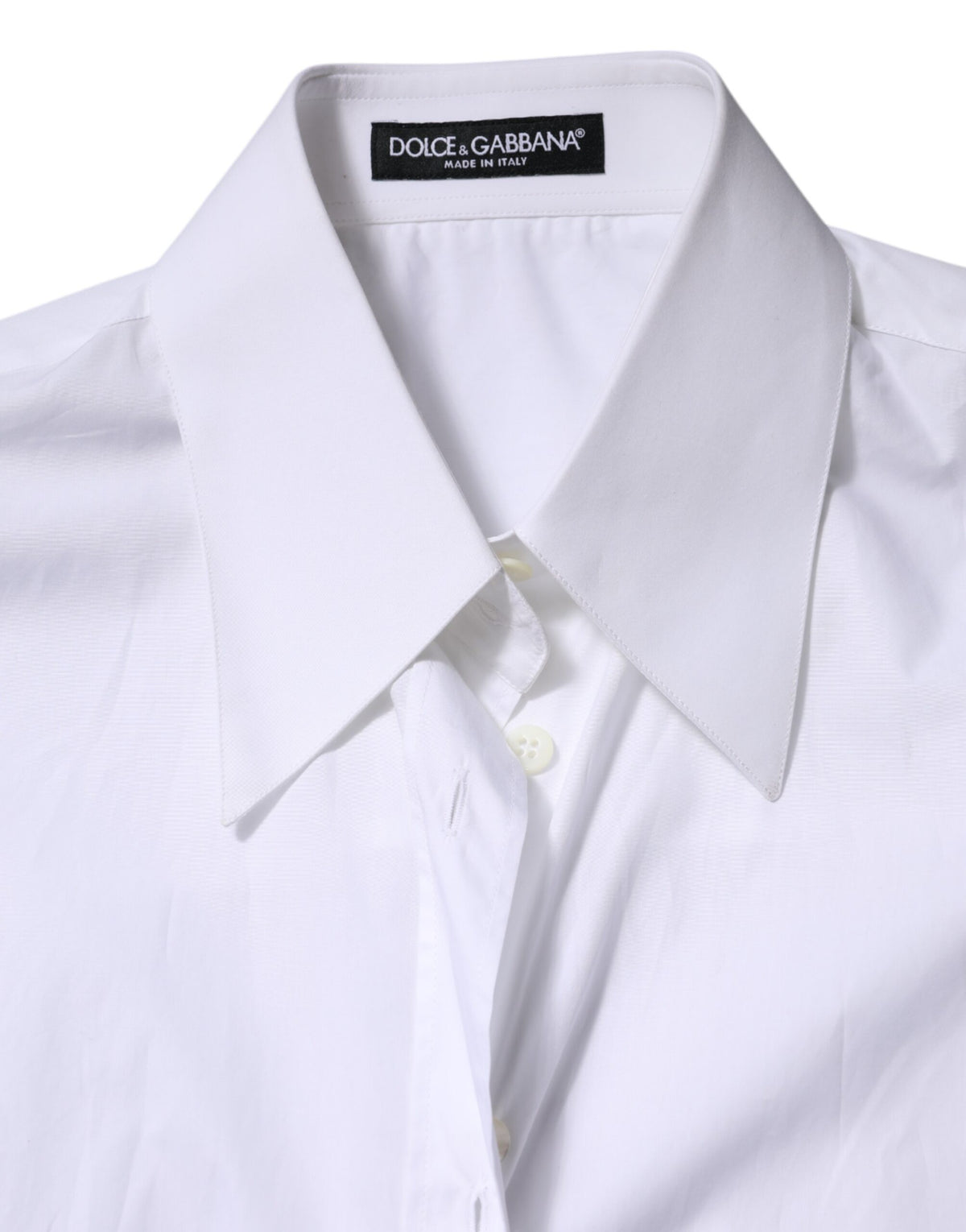Indulge in the exquisite craftsmanship of Dolce & Gabbana's White Cotton Collared Shirt, a timeless piece that embodies luxury and sophistication, perfect for the discerning individual.
