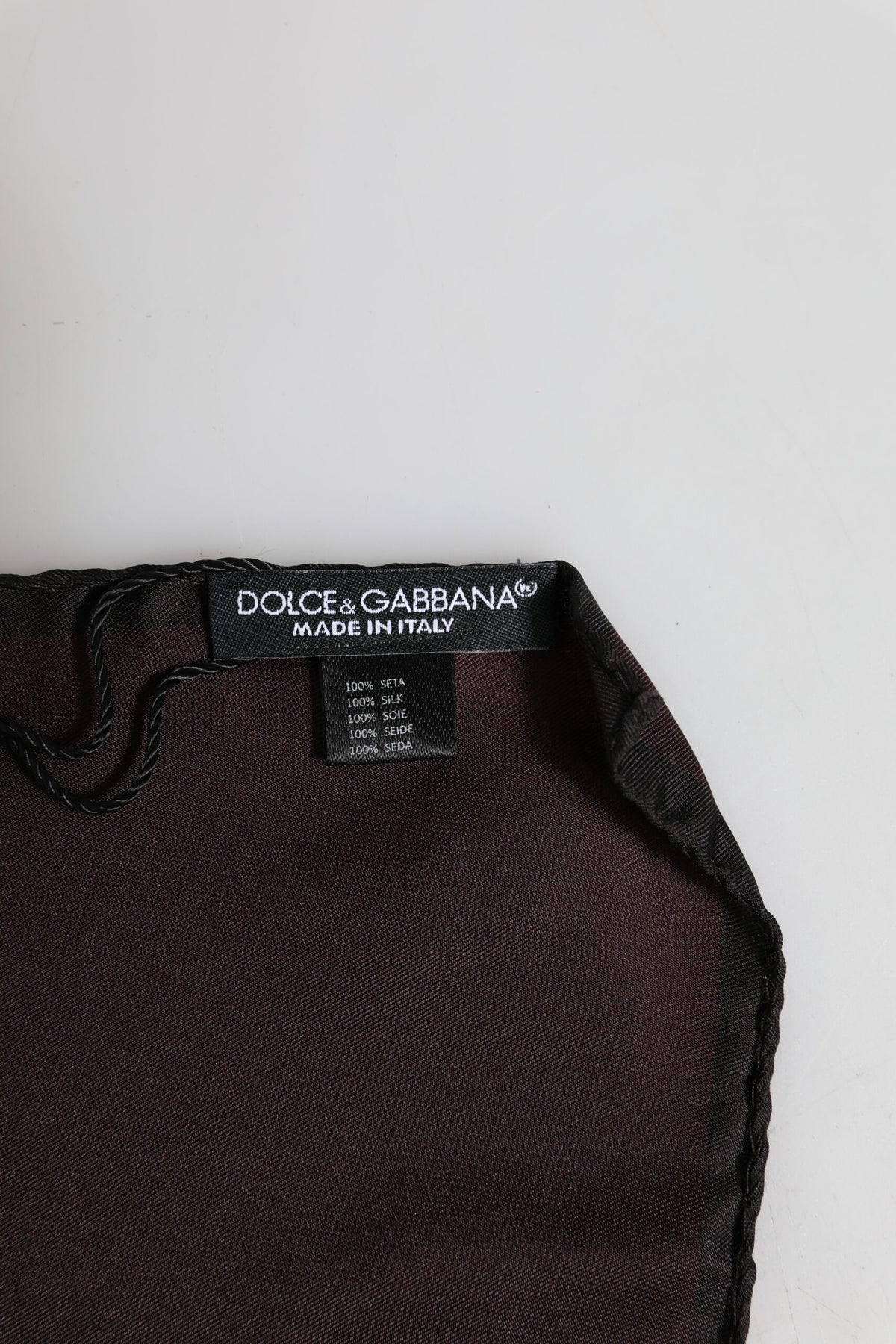Elevate your style with the Dolce & Gabbana Brown DG Crown Silk Square Men Foulard Scarf, an exquisite blend of luxury and sophistication, crafted in Italy from 100% silk.