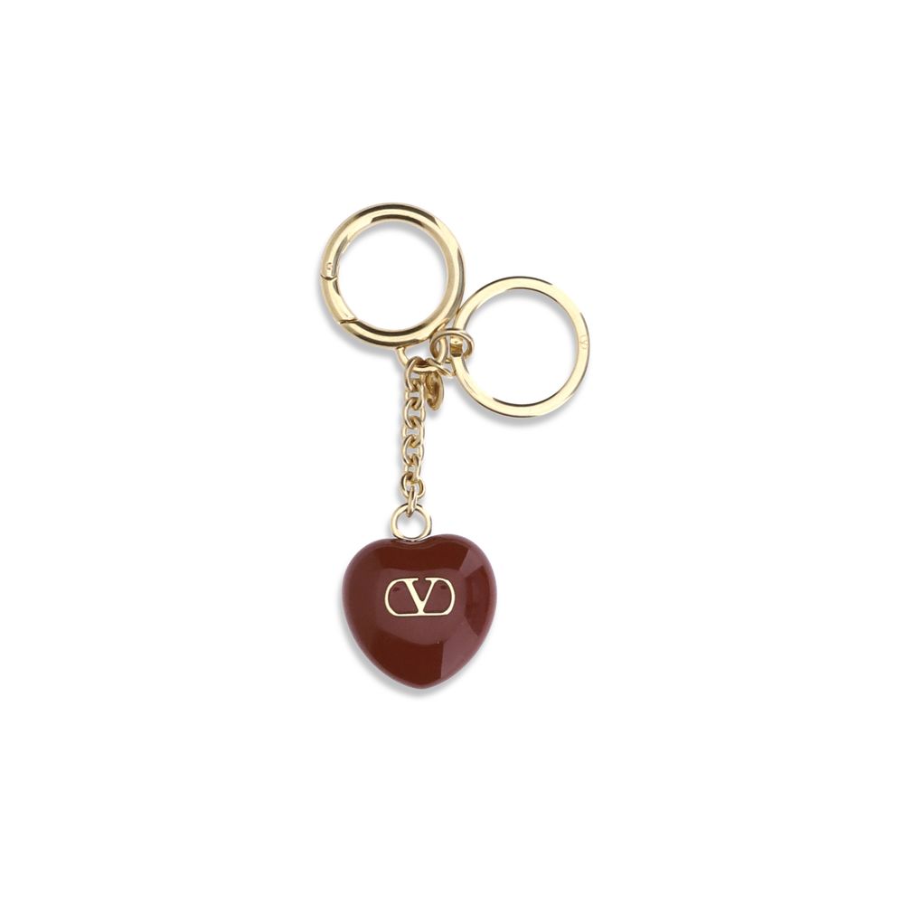 Elevate your accessory collection with the Valentino Garavani Bordeaux Metal Keychain, a luxurious blend of artistry and elegance, perfect for the discerning connoisseur.