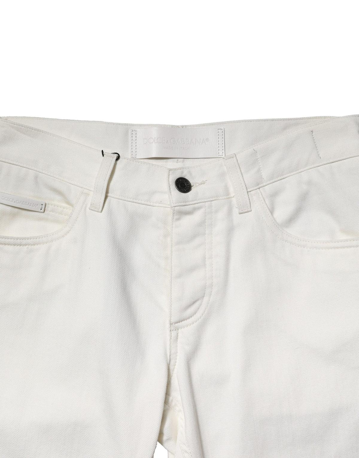 Indulge in the exquisite Dolce & Gabbana White Cotton Skinny Men Denim Jeans, where artisan craftsmanship meets luxurious comfort, elevating your style to new heights.
