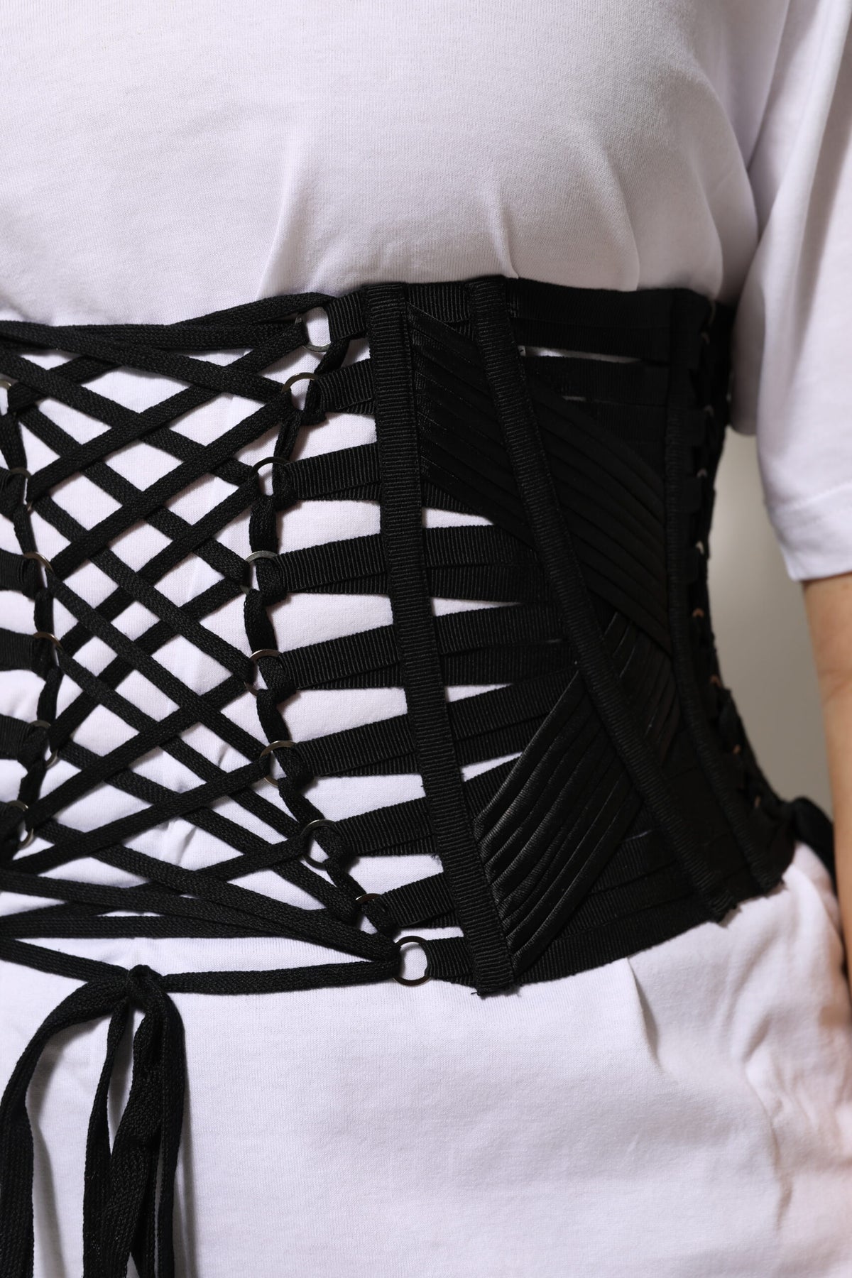 Elevate your style with the Dolce & Gabbana Black Cotton Waist Lace-Up Corset Belt, a luxurious embodiment of refined craftsmanship and timeless elegance.