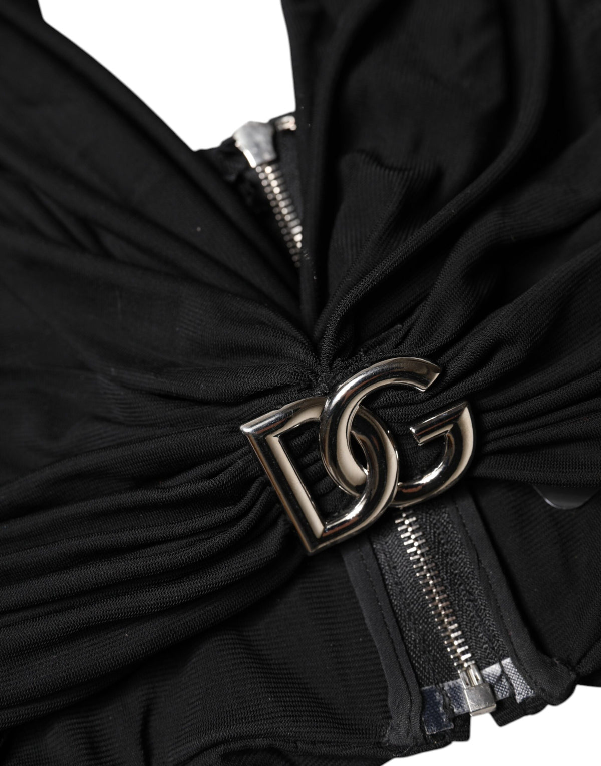 Elevate your wardrobe with the Dolce & Gabbana Black Cropped Viscose Halter Bustier Top, a luxurious blend of viscose, silk, and polyester that embodies sophisticated elegance.