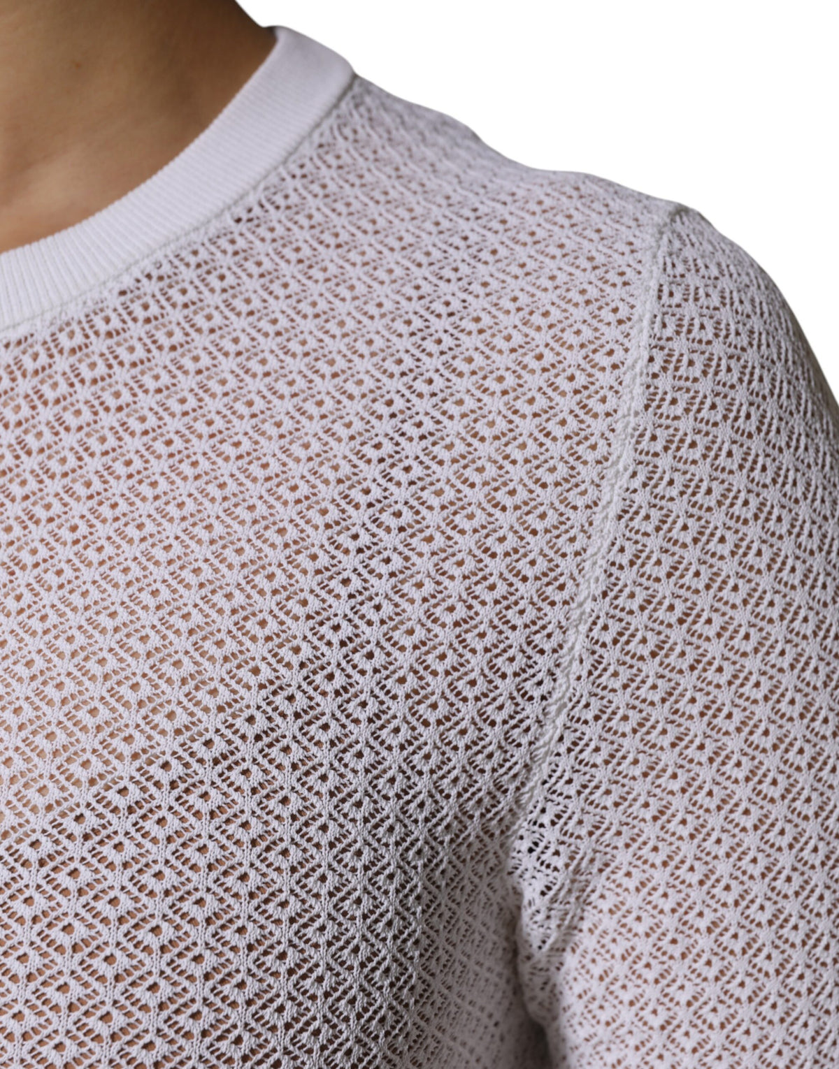 Elevate your wardrobe with the Dolce & Gabbana White Round Neck Long Sleeves Pullover Top, a masterpiece of Italian craftsmanship in a luxurious blend of viscose and polyester.